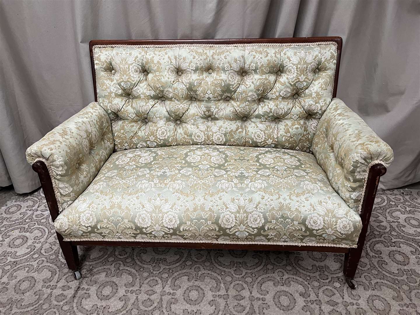 A deep-buttoned two seater settee as seen in the television series Normal People (Niall Mullen/PA)
