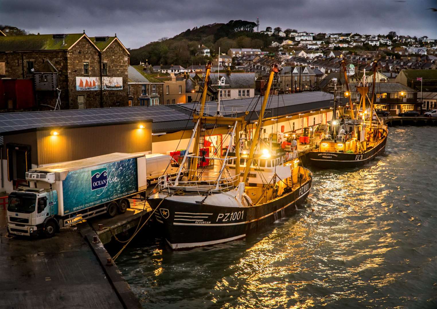 The winning picture in the Shipwrecked Mariners’ Society's 2020 photography contest, Beam Trawlers Landing to the Fish Market at Night by Laurence Hartwell.