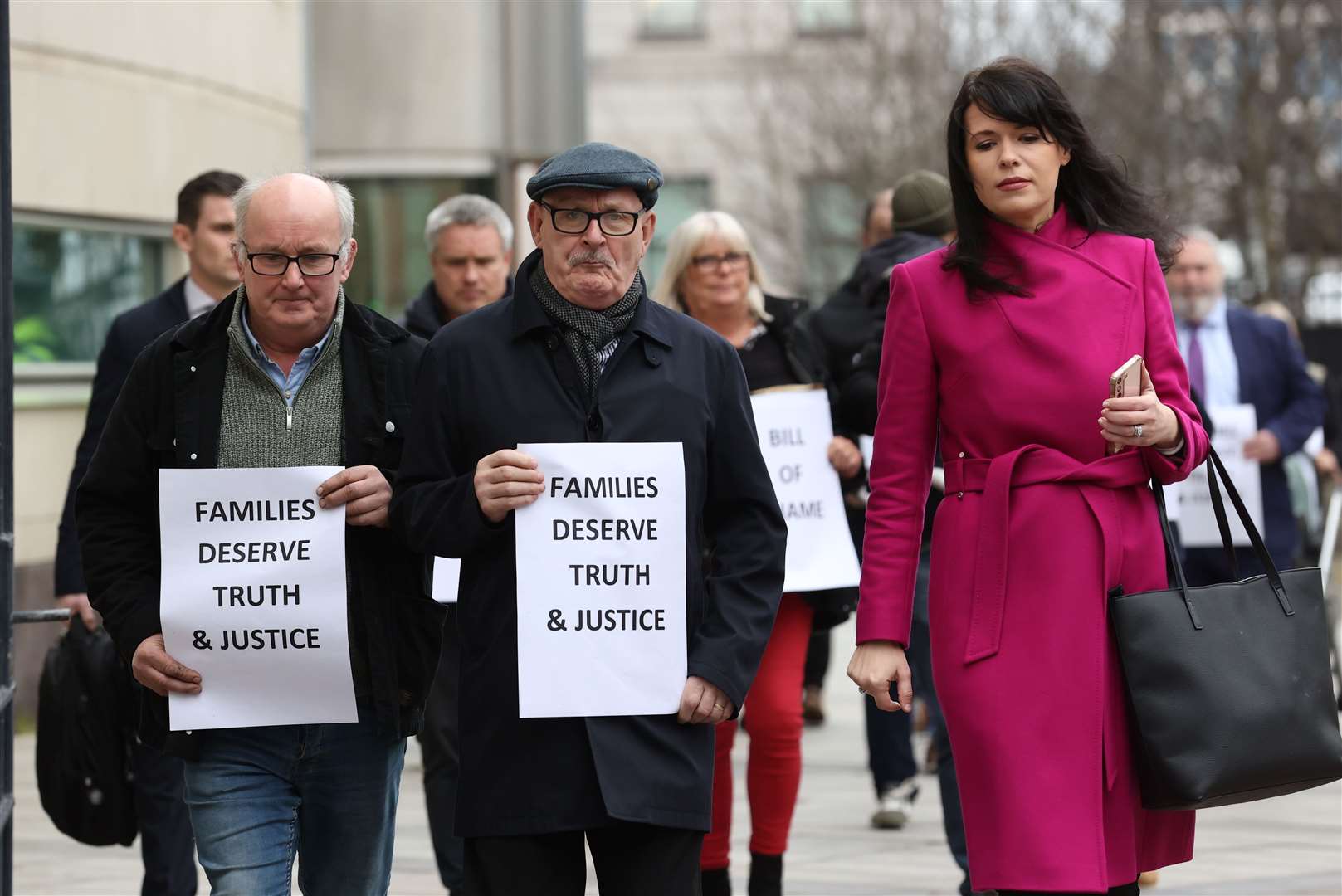 Sean McAnespie (centre), the brother of Aidan McAnespie, and Grainne Teggart (right) from Amnesty International outside Belfast Crown Court (Liam McBurney/PA)