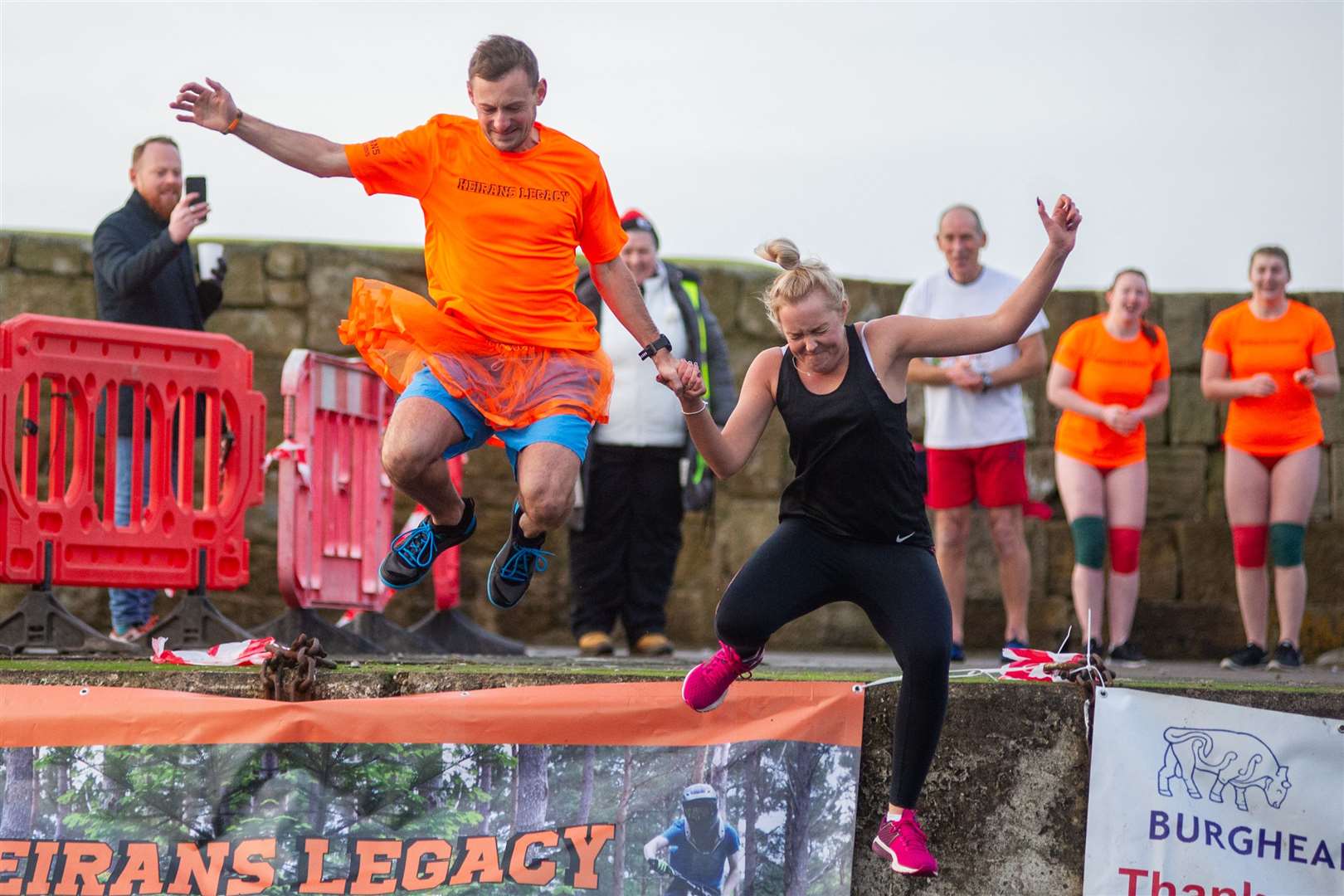 Rhianne Thomas takes the plunge with Tom Doney into Burghead harbour back in 2019. Picture: Daniel Forsyth..