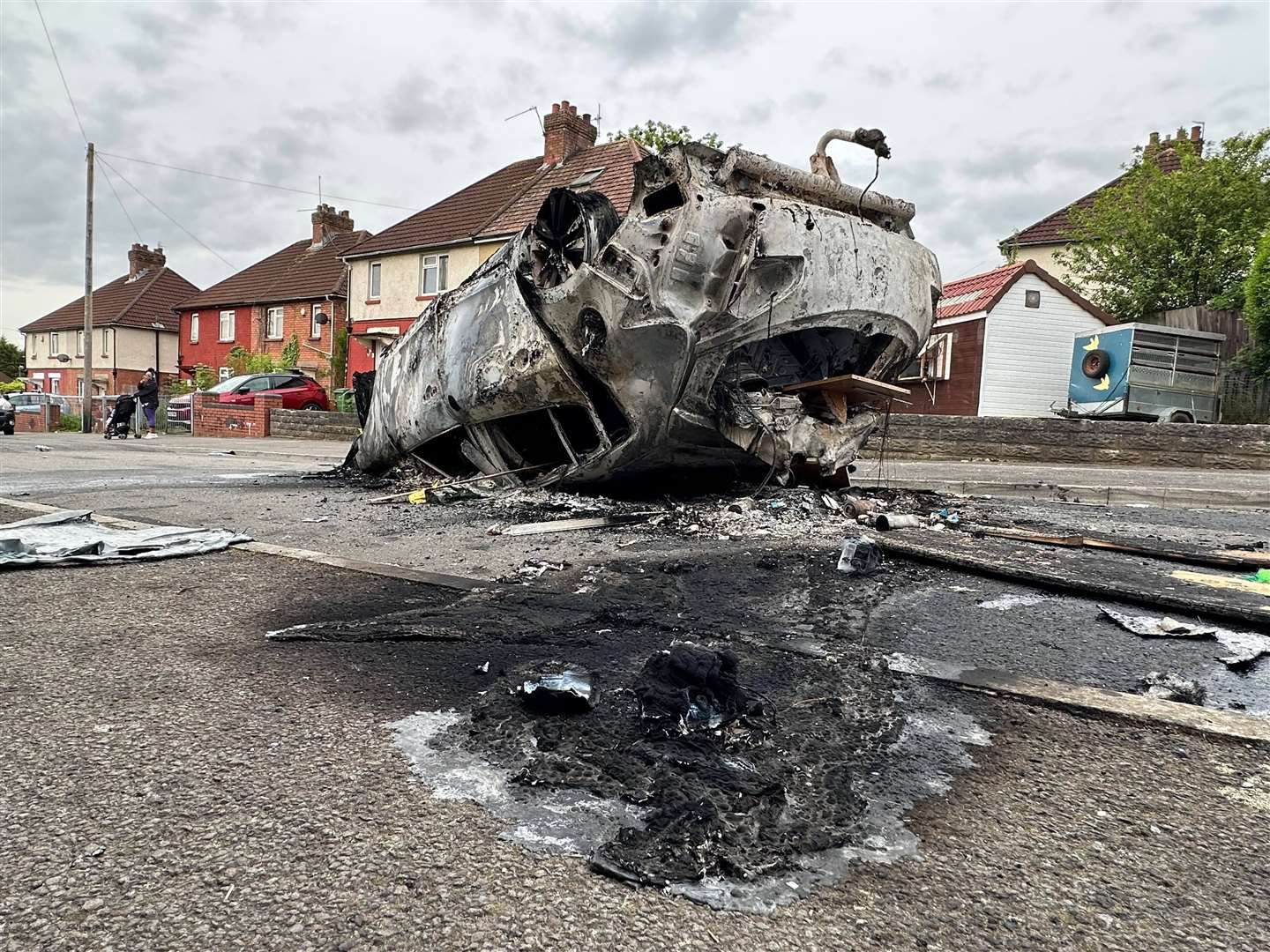 Cars were set alight during the rioting in Ely following the deaths of the two teenagers (PA)