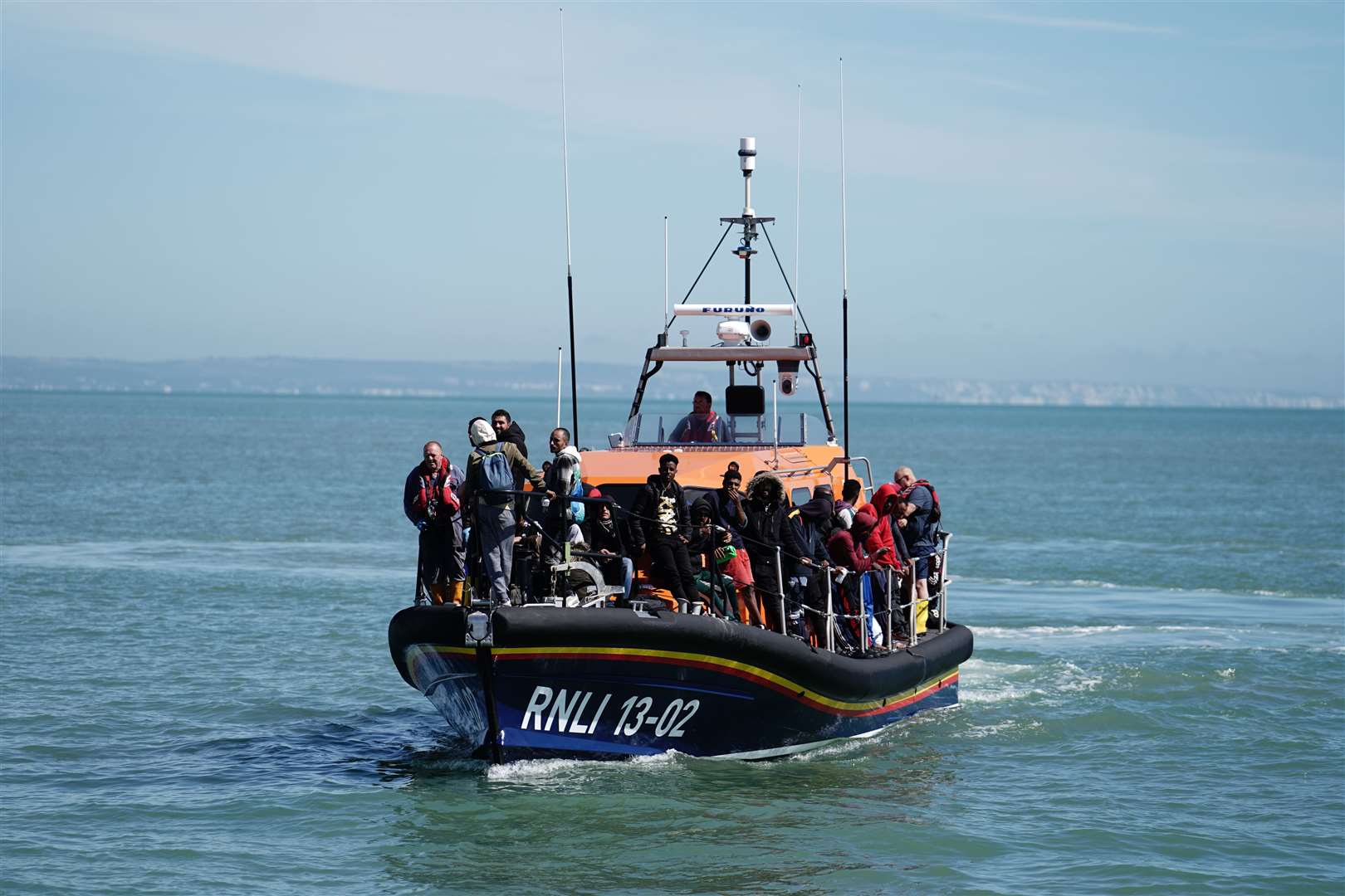 The RNLI’s Dungeness lifeboat heads to shore with people thought to be migrants on Wednesday (Jordan Pettitt/PA)