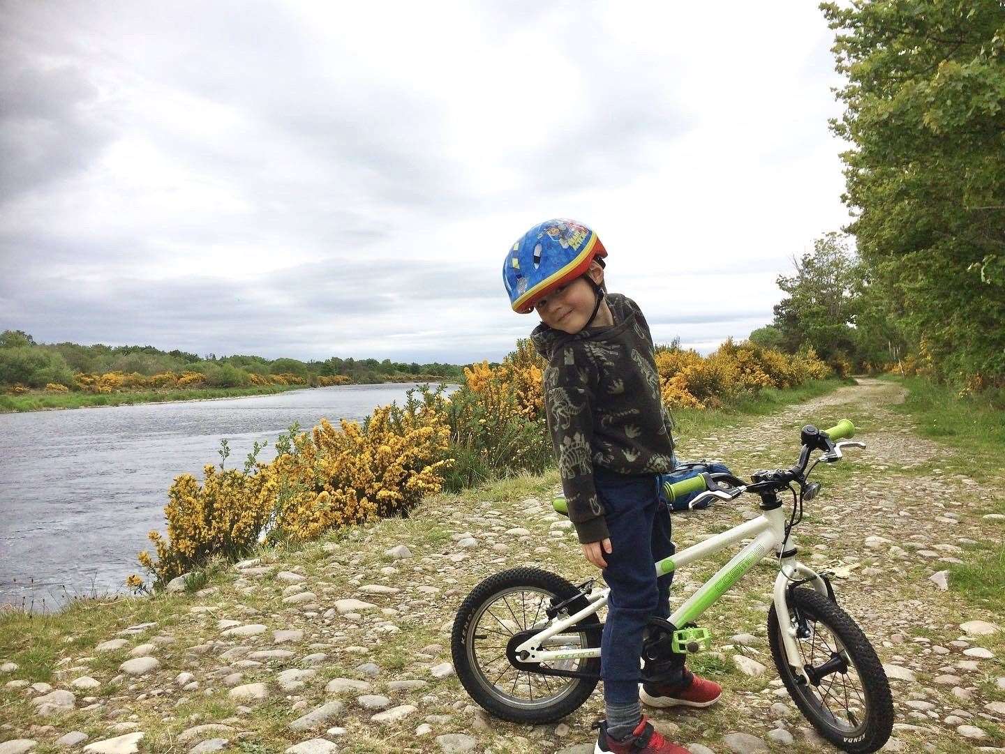 Four-year-old bike fan Aonghus Archibald, from Fochabers, is raising cash for Moray Food Plus.