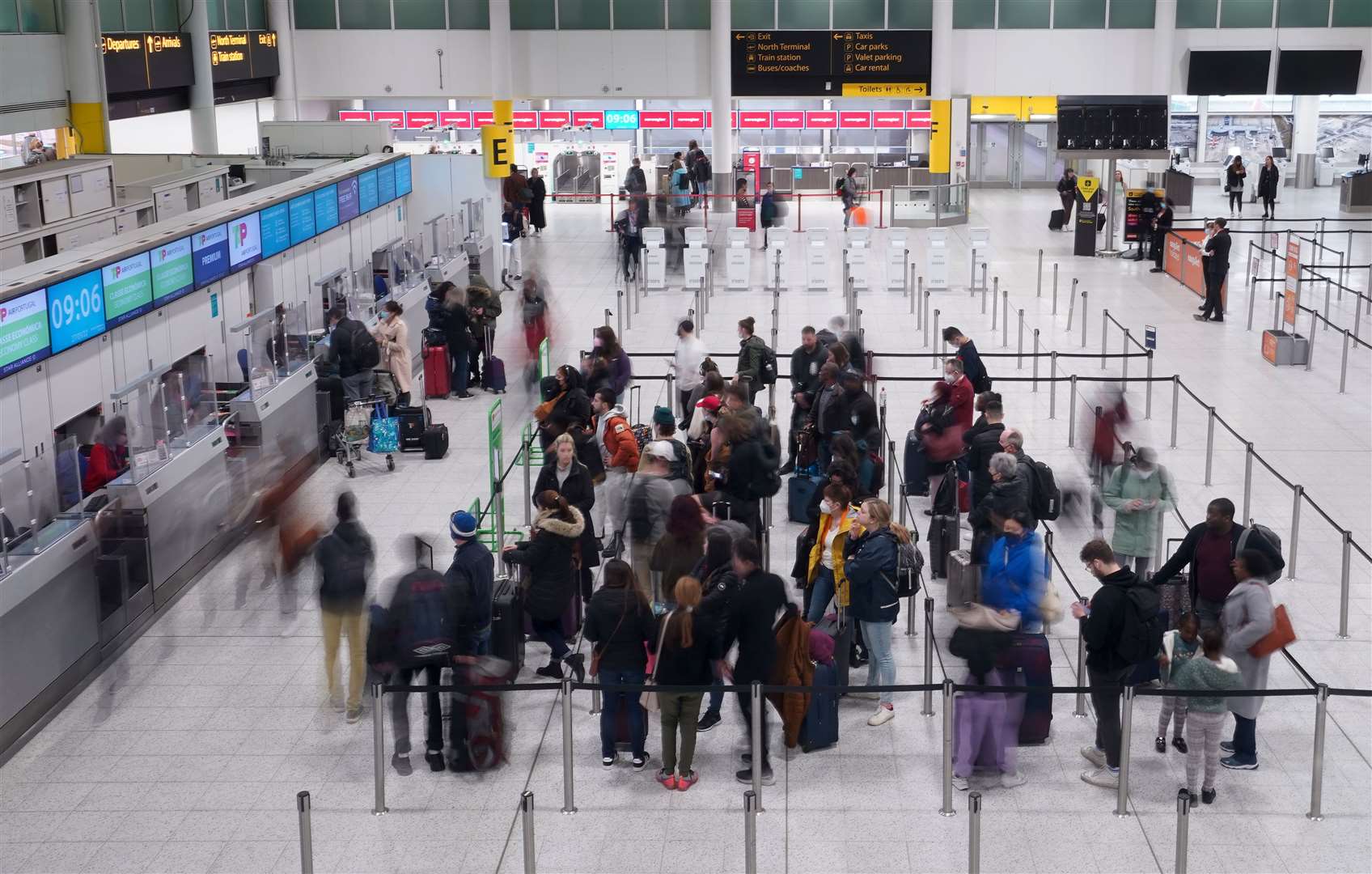 Passengers check-in at the South Terminal of Gatwick Airport (Gareth Fuller/PA)