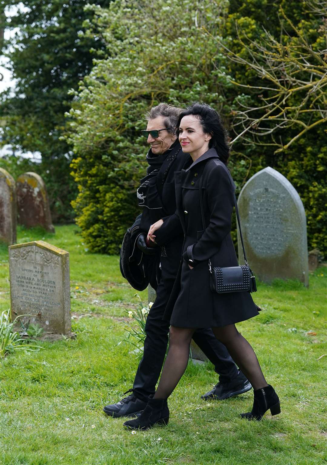 Ronnie and Sally Wood arrive for the funeral of Paul O’Grady (Gareth Fuller/PA)