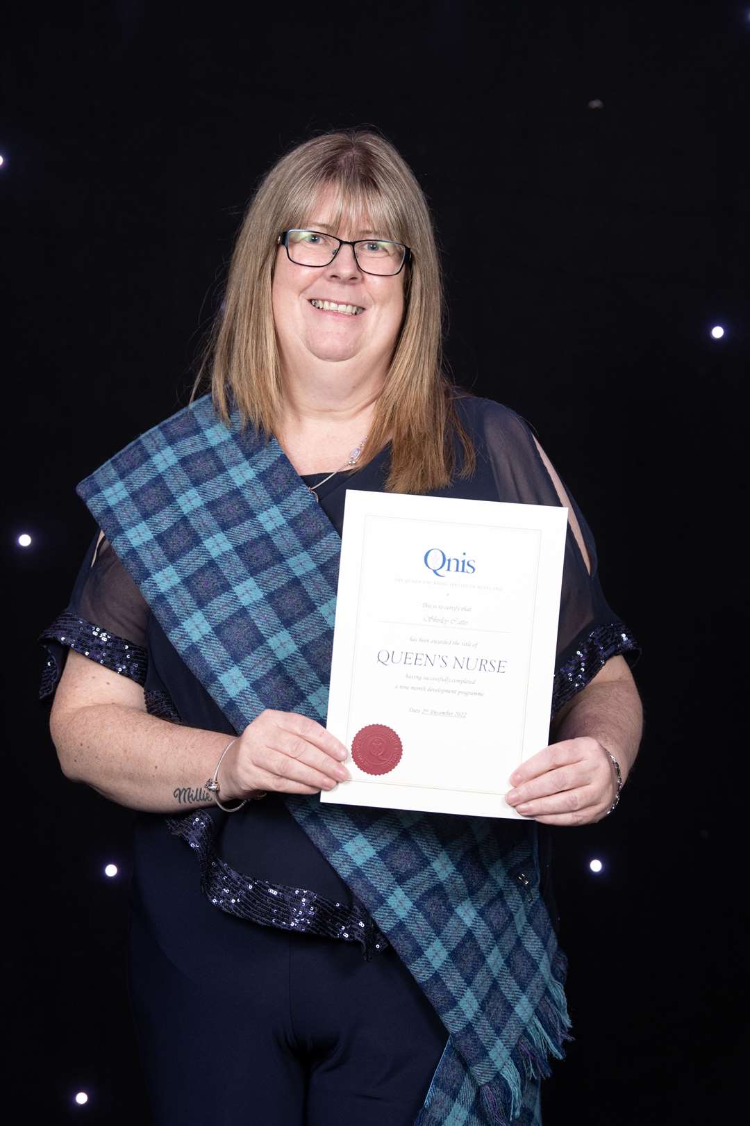 Shirley Catto proudly displays her Queen's Nurse award. Picture: Lesley Martin