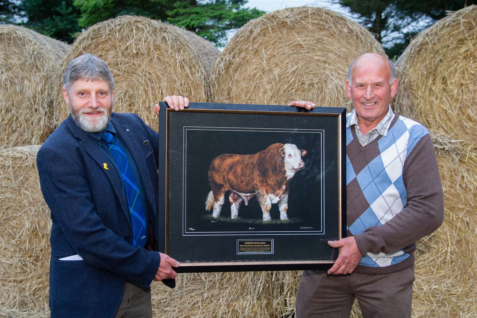 Gordon McKilligan of Headtown of Ord, Cornhill receives the Unsung Hero award from Martin Kennedy, President of NFU Scotland. Picture: Daniel Forsyth.