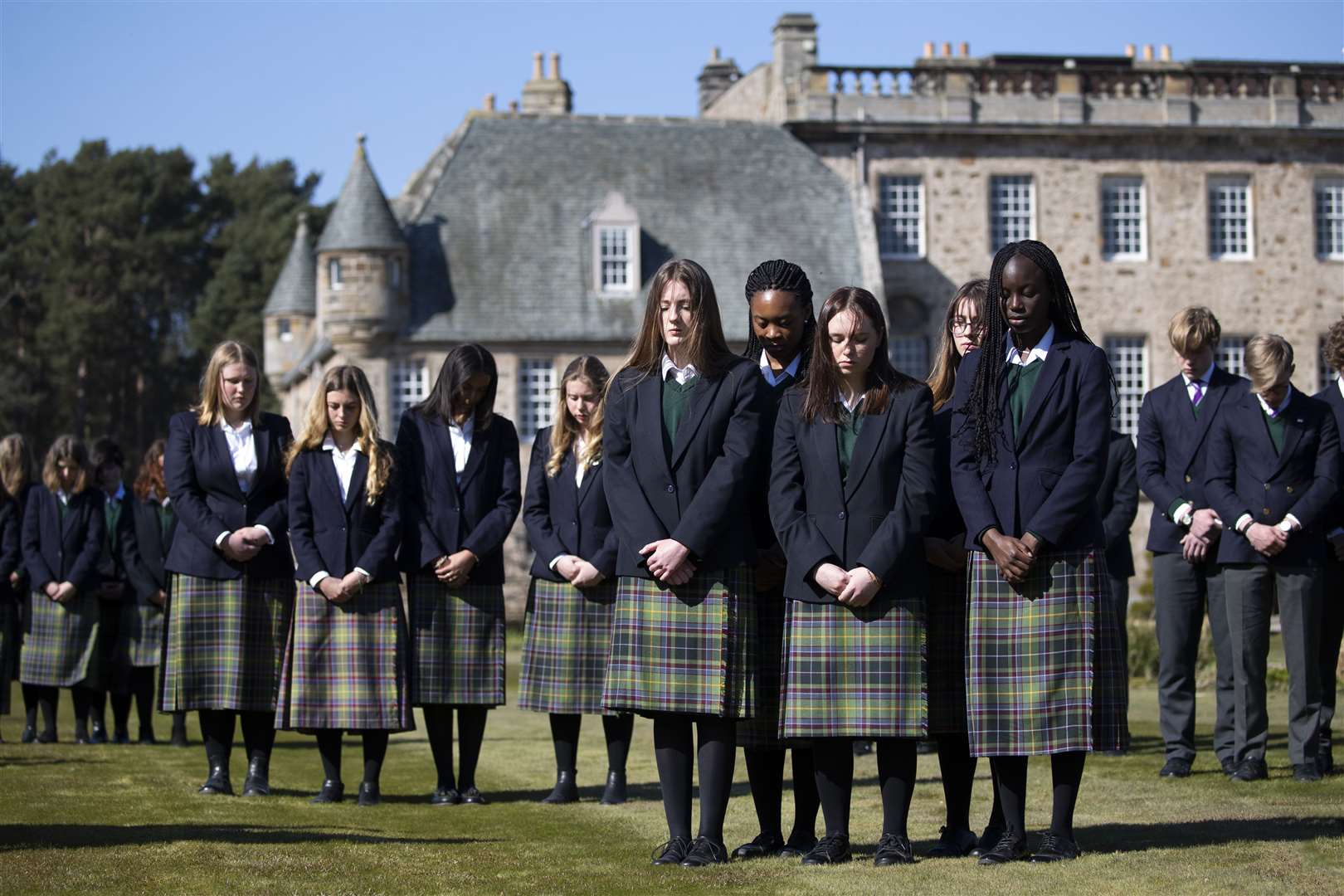 Pupils at his former school, Gordonstoun in Moray, observe the one-minute silence on the day of his funeral (Jane Barlow/PA)