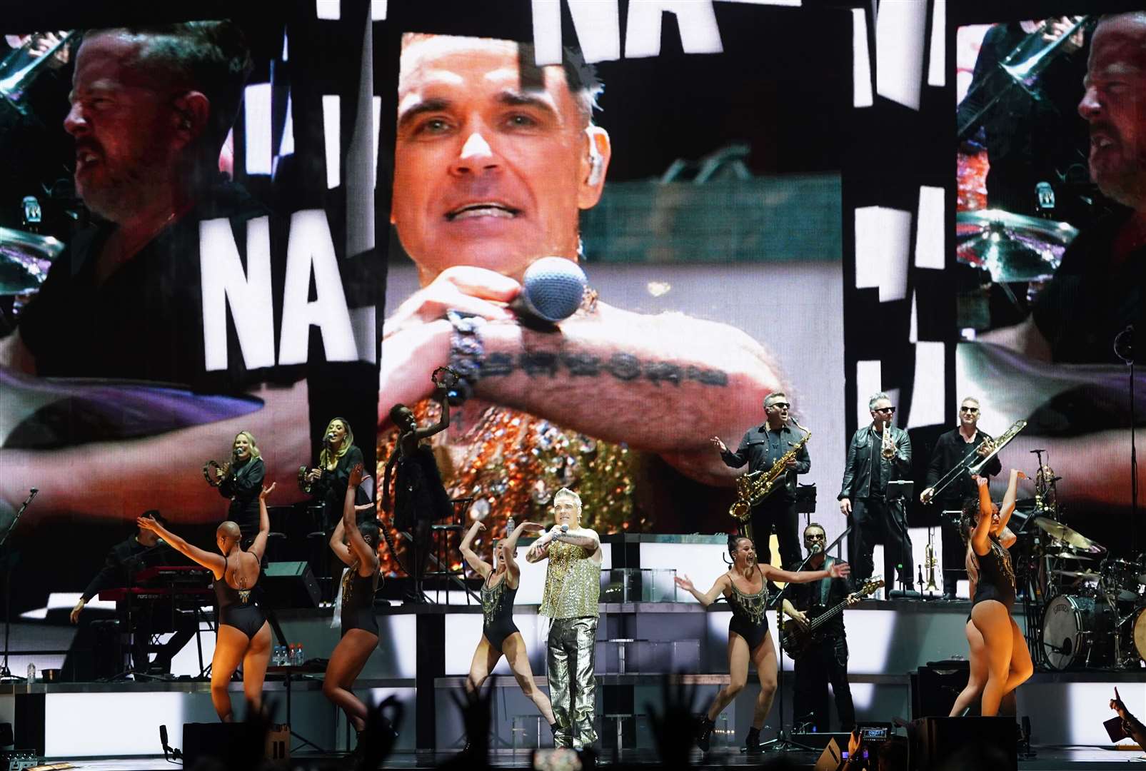 Robbie Williams performs at The O2 Arena in London (Ian West/PA)
