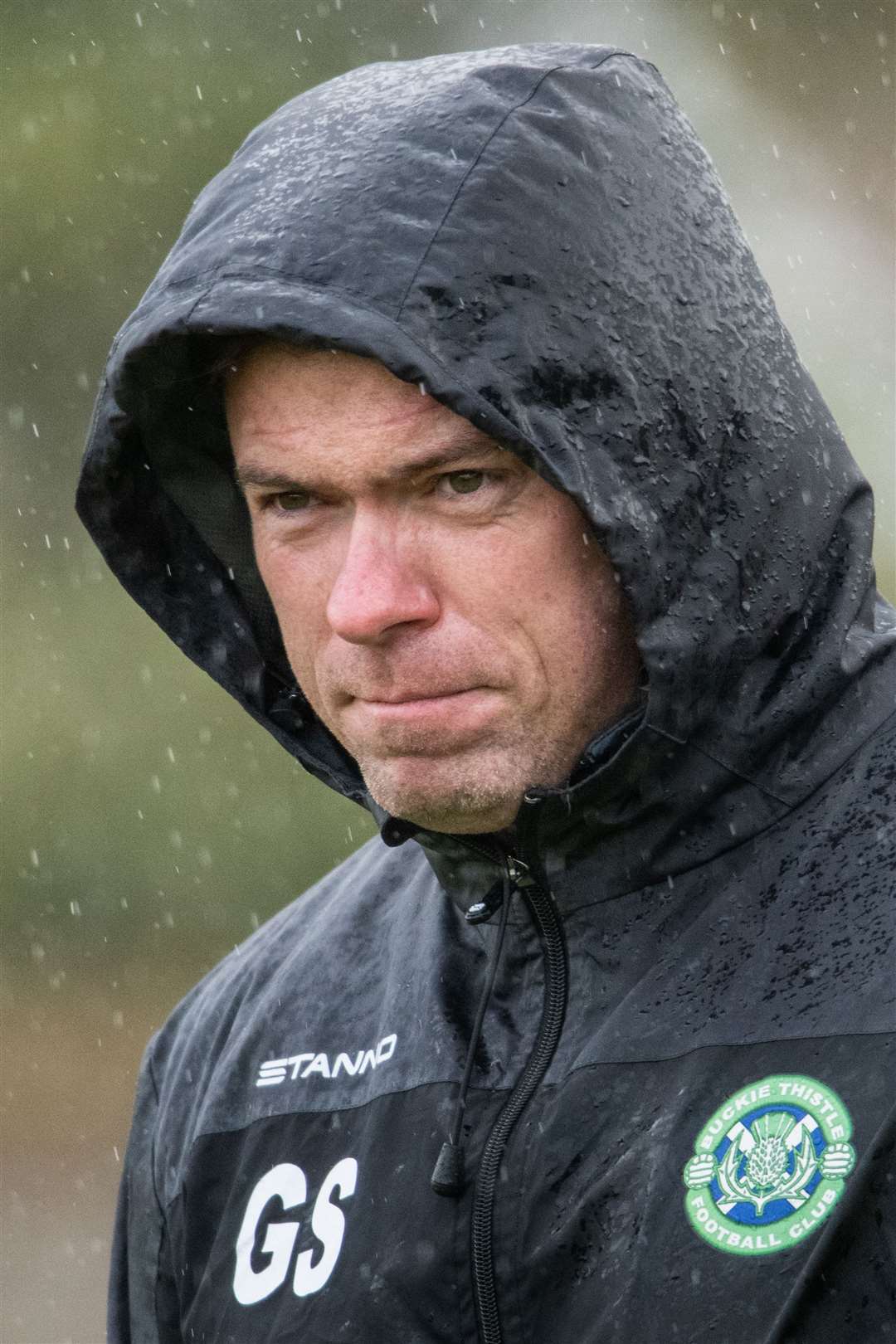 Hooded Buckie manager Graeme Stewart clearly wasn't enjoying the Lossiemouth weather. Picture: Daniel Forsyth..