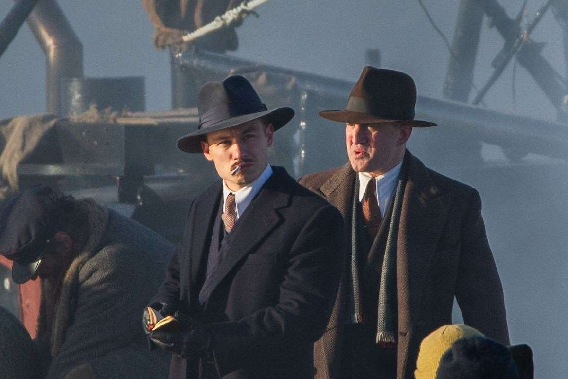 Michael Gray (left) - played by Finn Cole - smokes during filming. ..Peaky Blinders filming in Portsoy 12/02/2021...Picture: Daniel Forsyth..