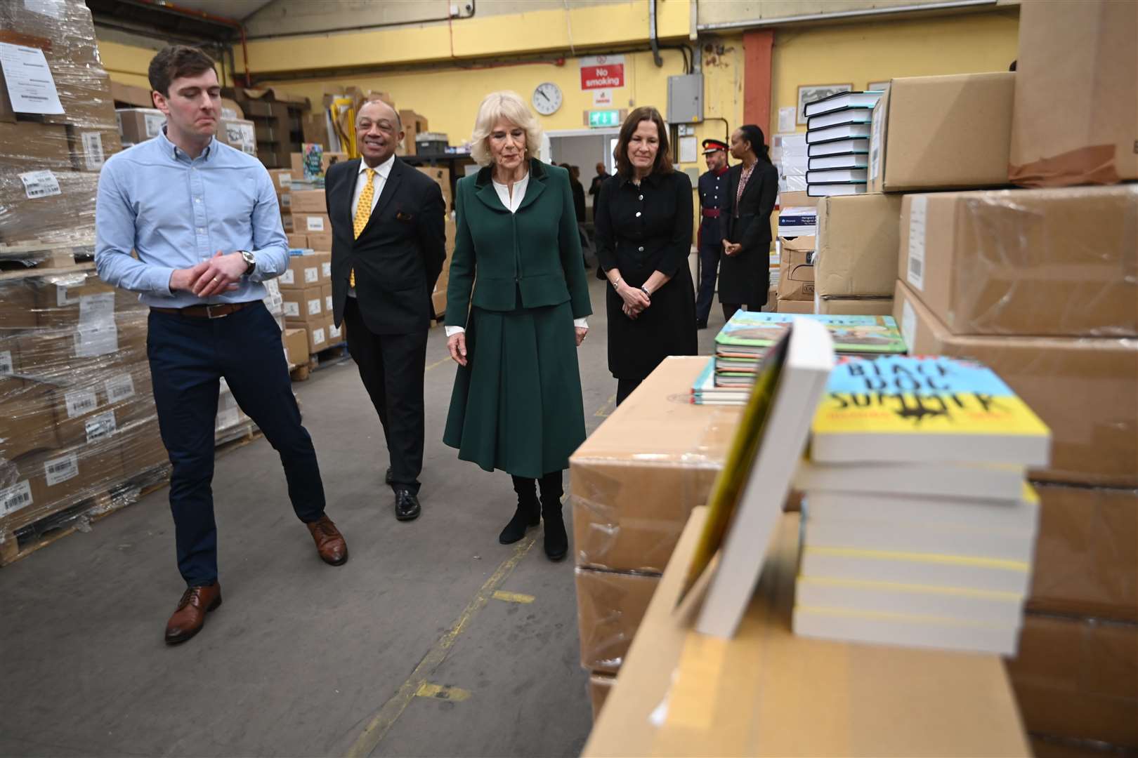 The Queen Consort met staff during her tour of Book Aid International’s warehouse (Eddie Mulholland/Daily Telegraph/PA)