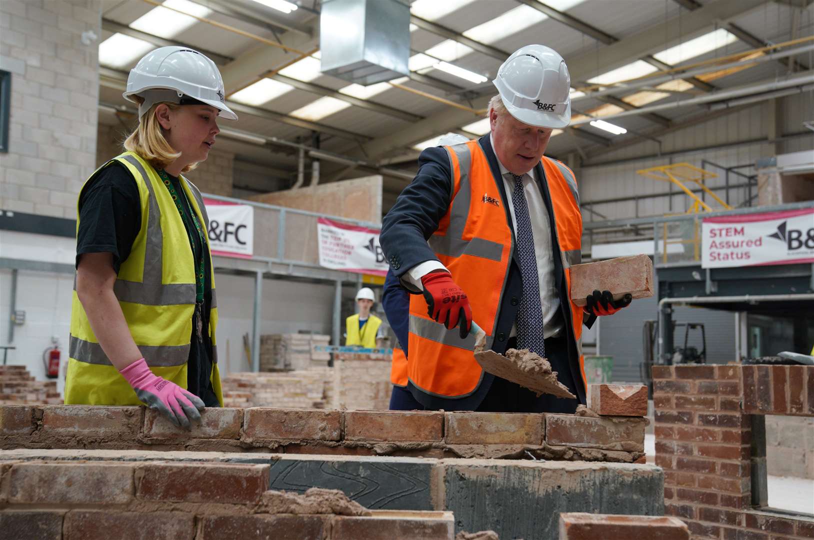 Boris Johnson takes part in a bricklaying lesson at Blackpool and The Fylde College (Peter Byrne/PA)