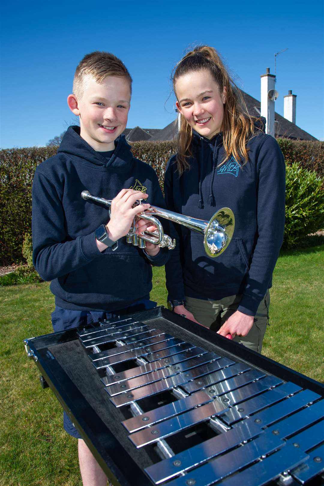 Finlay and Kate McLuckie with some of the new instruments acquired by Moray Concert Brass. Picture: Daniel Forsyth.