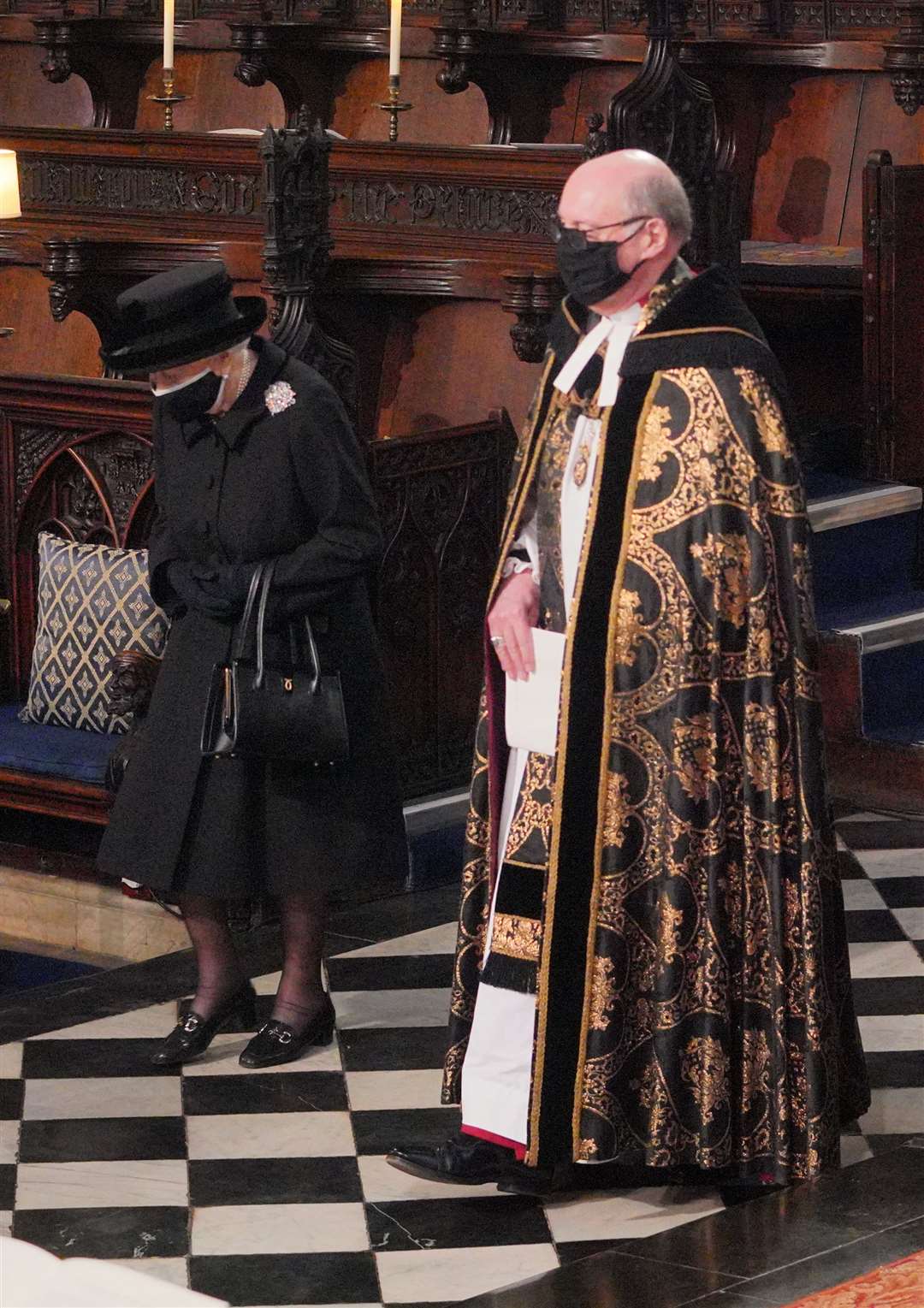 The Queen is accompanied by the Dean of Windsor into the quire of St George’s Chapel (Dominic Lipinski/PA)