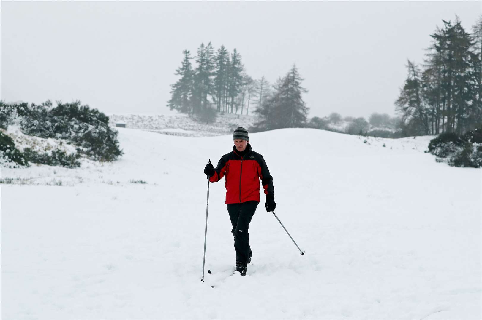 A man walks through the snow at Gleneagles (Andrew Milligan/PA)