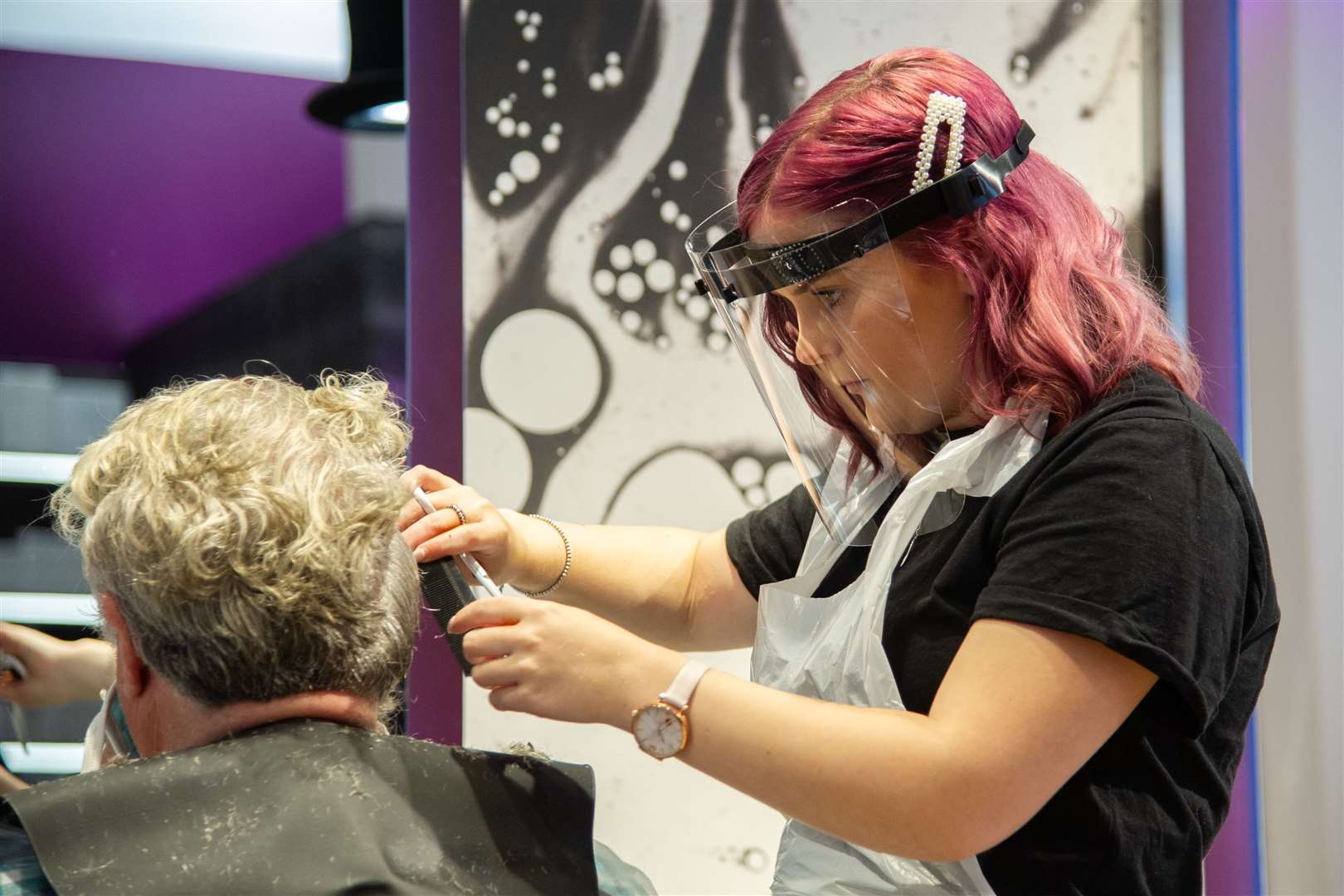 Ailsa Fraser, stylist at Hair and Body Mechanics, in Elgin, with a customer. Picture: Daniel Forsyth.