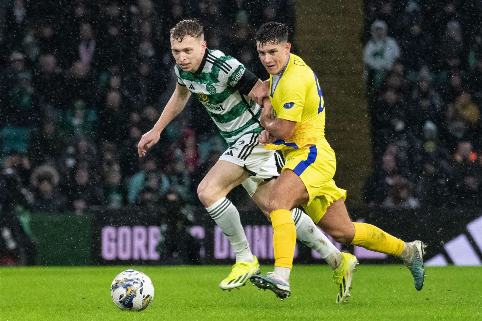 Buckie's Max Barry tussles with Celtic's Alistair Johnston. Picture: Daniel Forsyth..