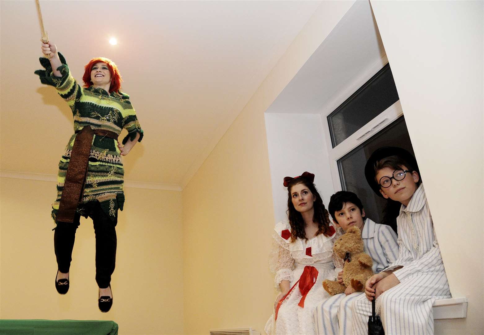 It's up, up and away for Peter Pan (Vickie Slater) as (seated from left) Wendy (Holly Allerdyce), Michael (Zander Mitchell) and John (Jaye Farley) look on. Picture: Eric Cormack