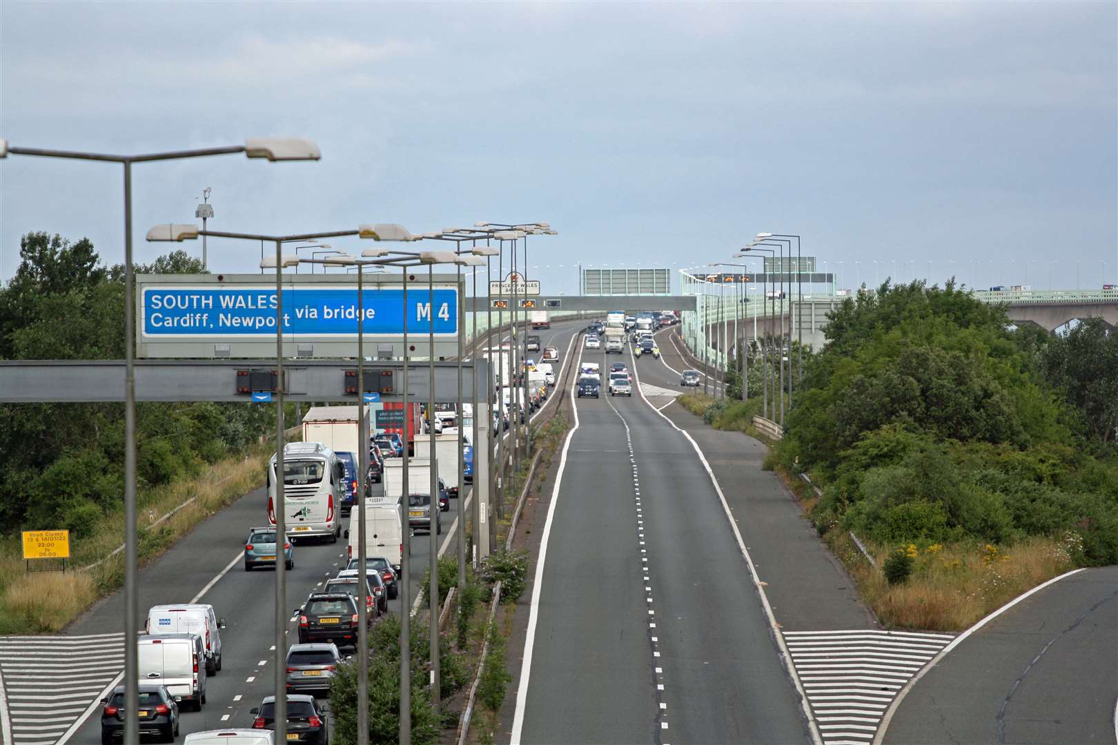 Police escort vehicles across the Prince of Wales Bridge, which runs between England and Wales, during the morning rush hour as drivers hold a go-slow protest on the M4 (PA/Rod Minchin)