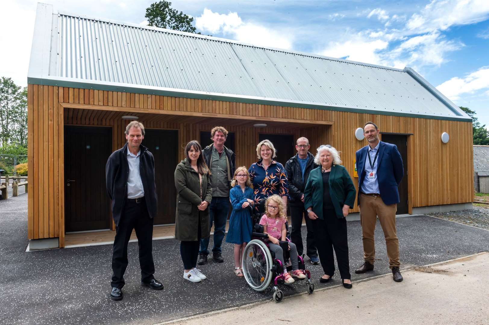 Pictured at the new Changing Places accessible toilets at Aden Country Park are (from left) Cllr David Mair, Cllr Hannah Powell, Neil Shirran, Aden Project Co-ordinator, Donna-May Clauson with Sophia and Zara-May Clauson, Cllr Geoff Crowson, Cllr Anne Simpson and David Jackson, Regional Director at VisitScotland