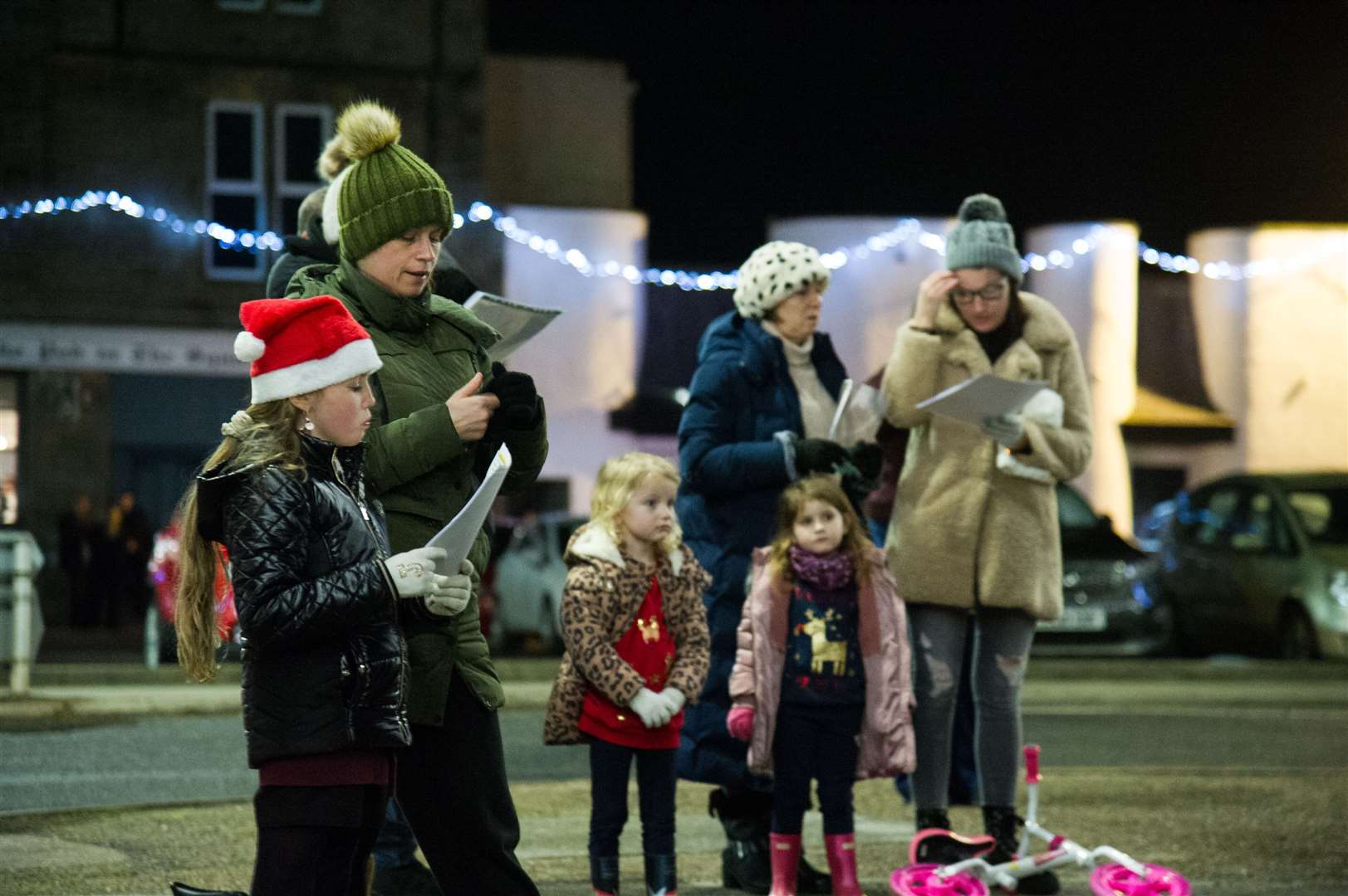 These families join in the festive tunes. Picture: Becky Saunderson