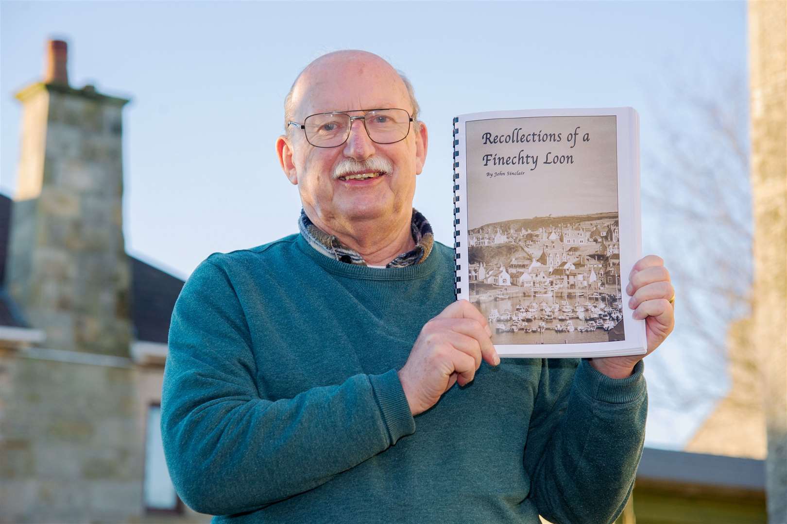 Finechty loon John Sinclair with a copy of his globetrotting memoirs. Picture: Daniel Forsyth