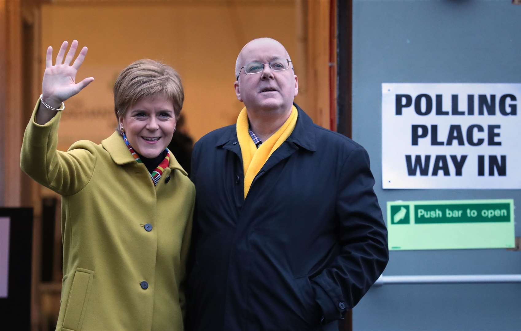 Peter Murrell, right, has quit as SNP chief executive (Andrew Milligan/PA)