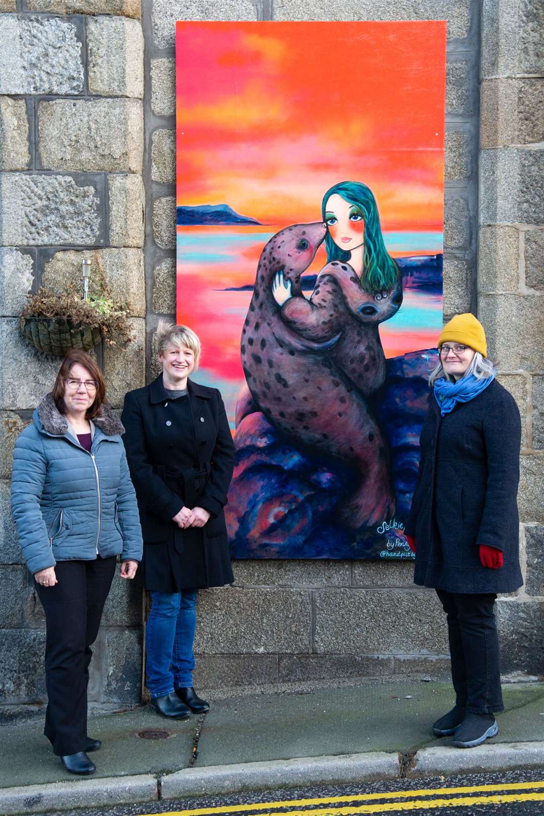 From left; Lynn MacKinnon, Vivien Rae and Rachel Kennedy at one of the Macduff murals.Picture: Daniel Forsyth