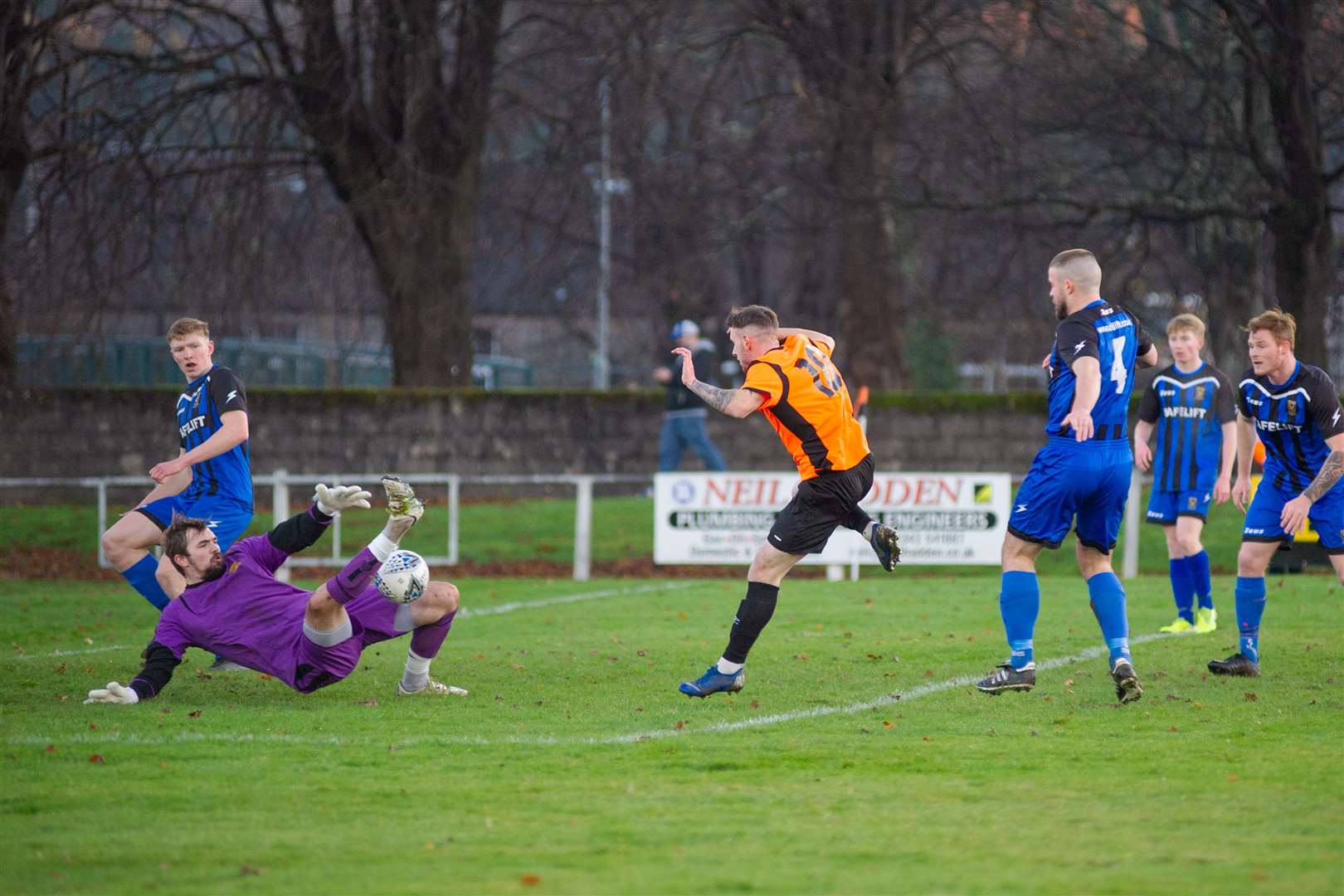 Huntly goalkeeper Euan Storrier pulls off a succession of good saves to deny Alisdair Sutherland a goal for the home side...Rothes FC (1) vs Huntly FC (0) - Highland Football League - Mackessack Park , Rothes 28/11/2020...Picture: Daniel Forsyth..