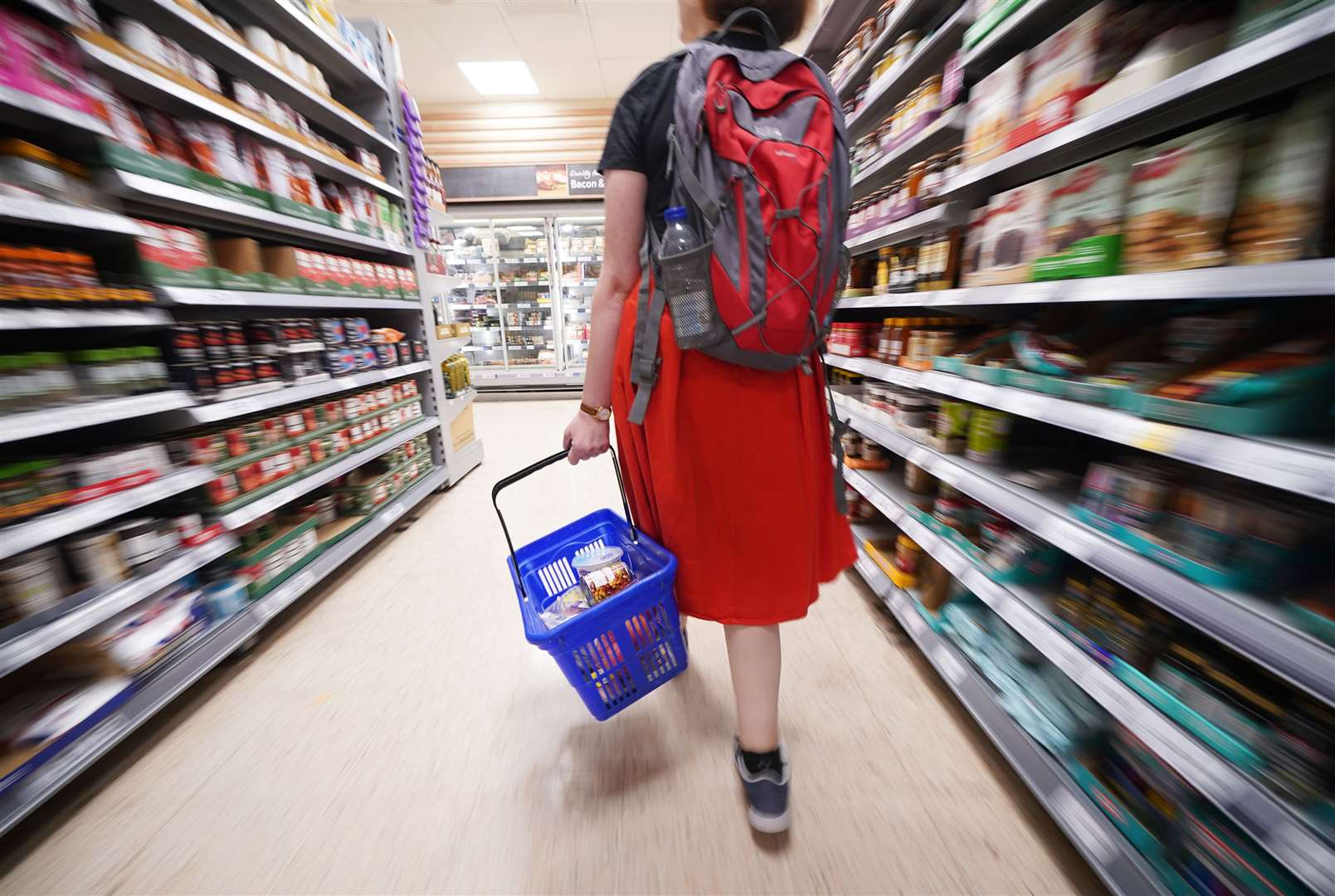 File photo dated 03/09/22 of a shopper walking through the aisle of a Tesco supermarket (Yui Mok/PA)