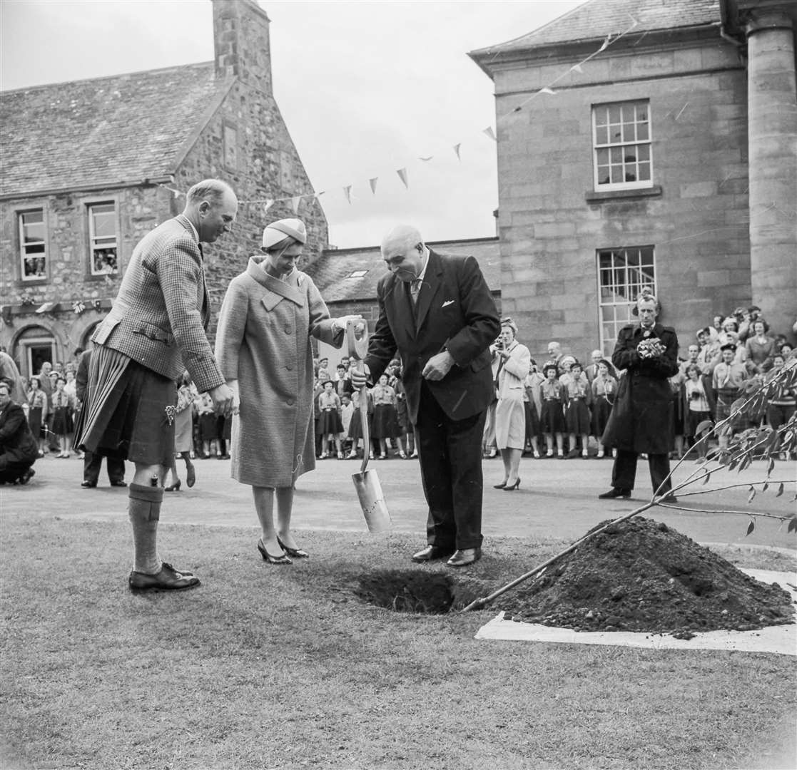 The Queen plants a tree at Fochabers in 1961. People can pay floral tributes to Her Majesty in gardens designed at Moray and these will eventually be composted for future tree planting in her memory.  Image: The North Scottish Archives