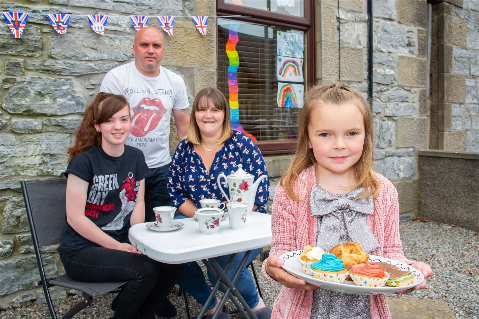 Meg Gray with her family - sister Hannah, father Barry and mother Nicola - ahead of their VE Day garden party. ..75th anniversary celebrations of VE Day in Dufftown, Moray. ..Picture: Daniel Forsyth..