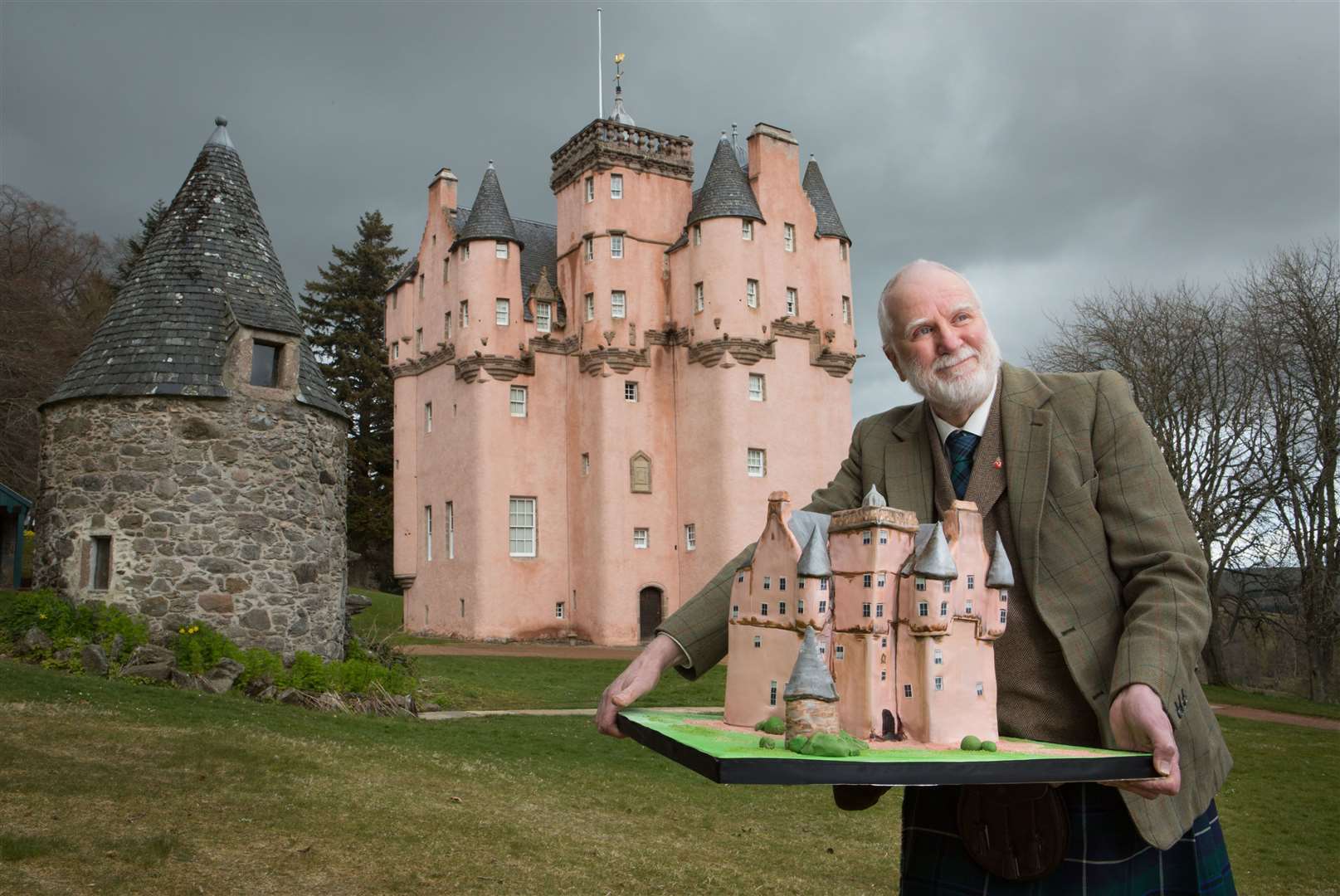 Visitor services supervisor for the National Trust for Scotland at Craigievar Castle John Lemon with a cake to mark the trust's 90th anniversary. Picture: Alison White Photography