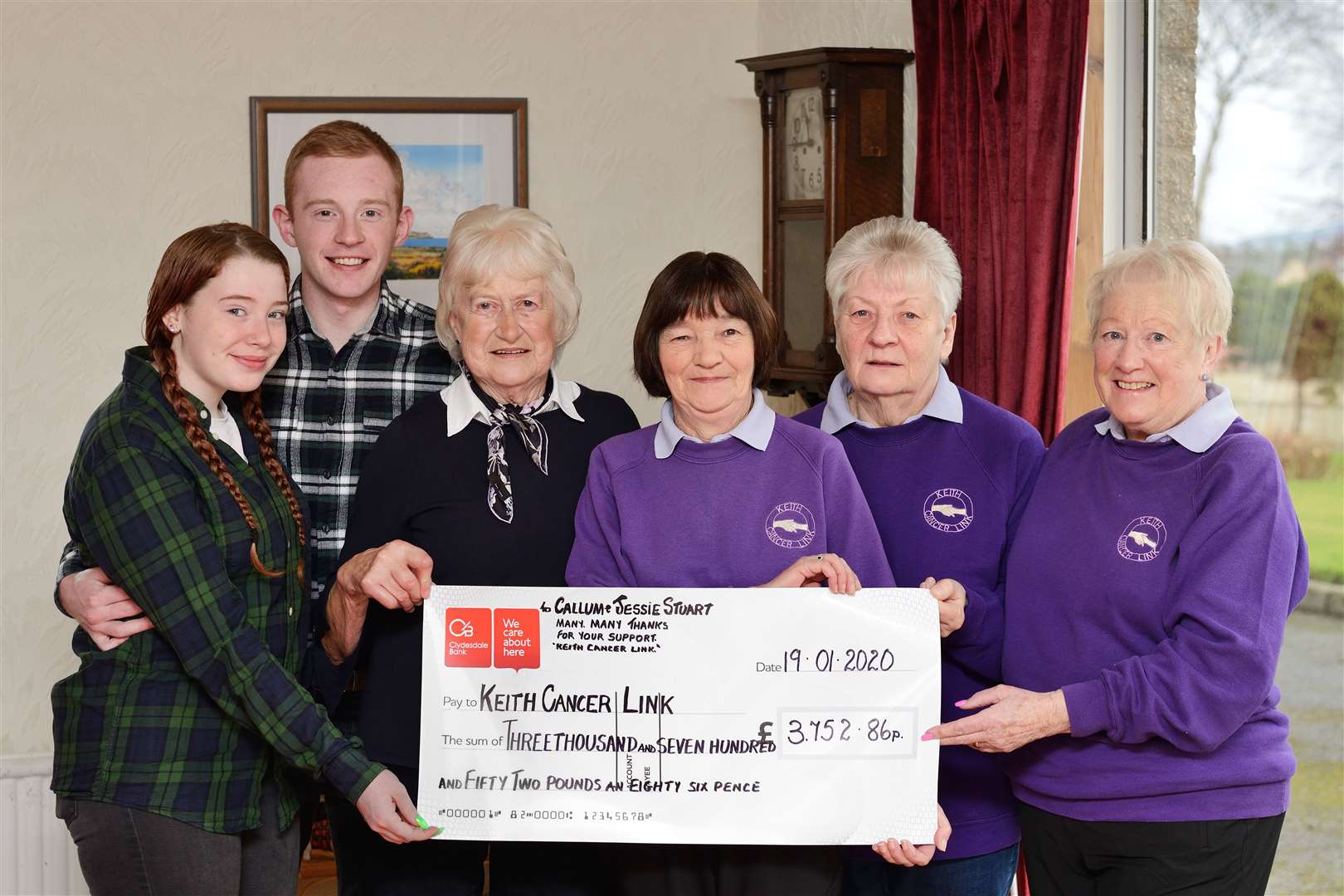 Keith man Callum Stuart and (from left) girlfriend Kayleigh Dalgarno and granny Jessie Stuart present a cheque for £3752 to Keith Cancer Link's Isobel Sadowski, Irene Martin and Adeline Reid. Picture: John MacLeod/Moraylight.