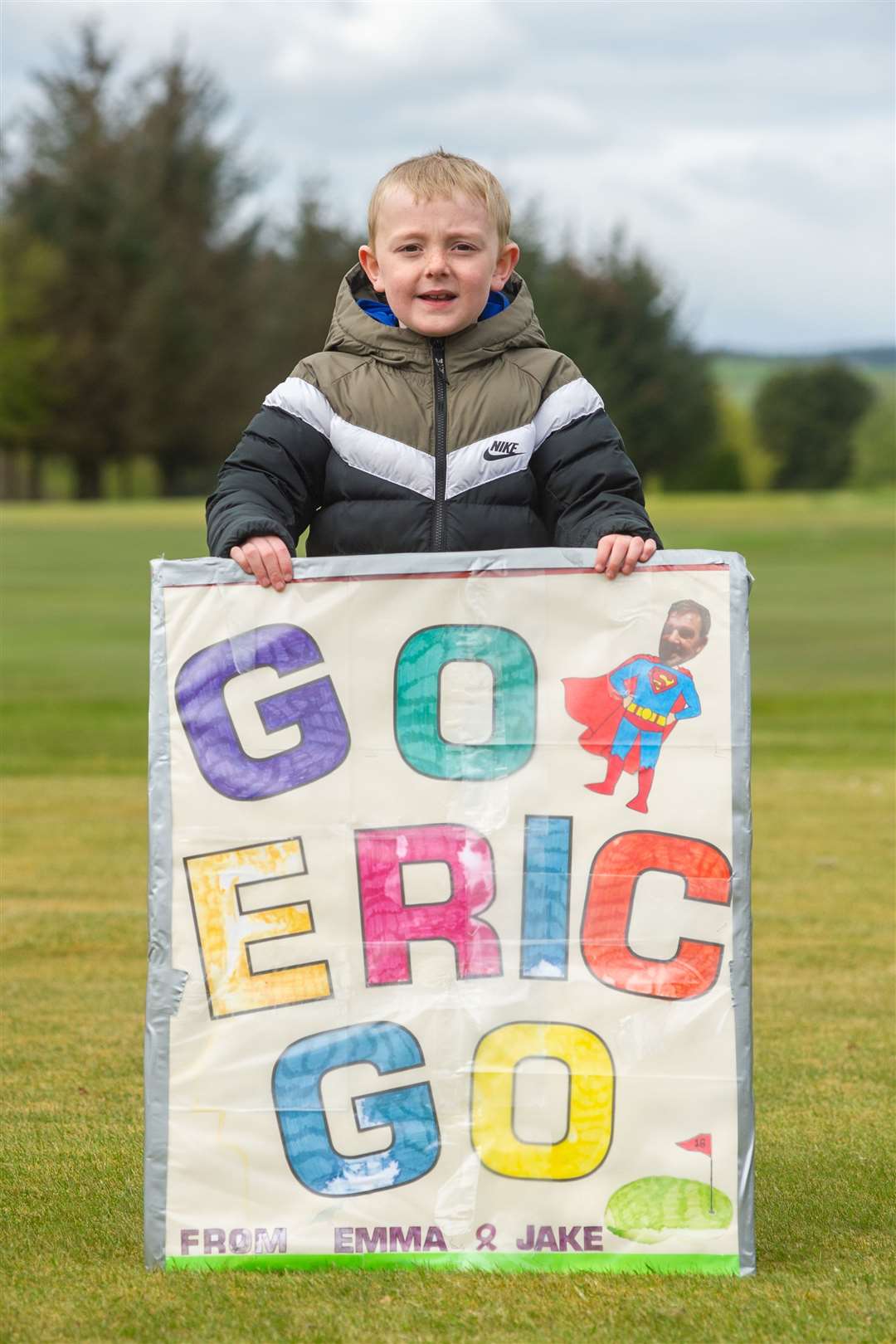 Jake Taylor with a sign of encourgement he made for Eric...After 300 laps around Keith Golf Club's 18th green - Eric Sharp completes his five-day fundraising marathon. ..Picture: Daniel Forsyth..