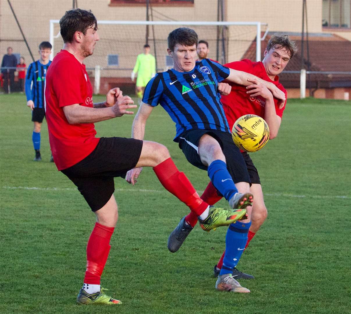 Ellon United's Dean McDonald and Scott Gray close in on the Hermes player. Picture: Phil Harman