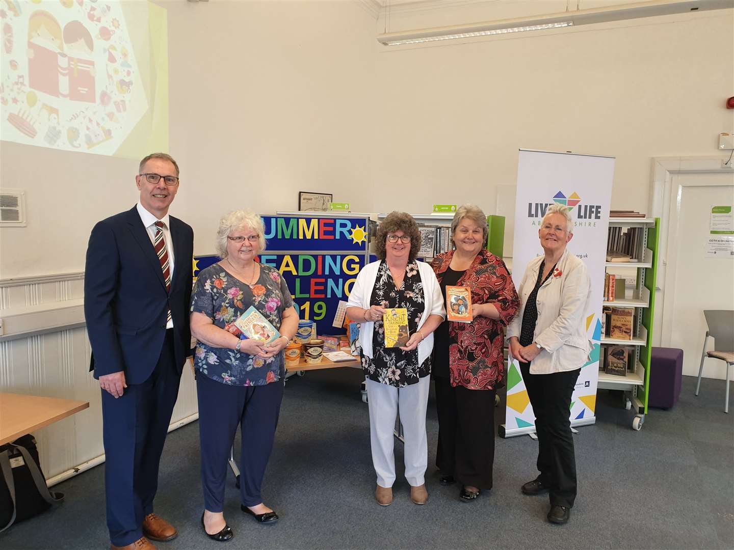 At the launch of the Summer Reading Challenge are (from left): Gerry Stephens, financial director for Mackie’s of Scotland; councillor Anne Simpson, Aberdeenshire Council’s culture and sport sub-committee vice-chairwoman; councillor Gillian Owen, Aberdeenshire Council’s education and children’s services committee chairwoman; councillor Anne Stirling, Aberdeenshire Council’s communities committee chairwoman and author Vivian French.
