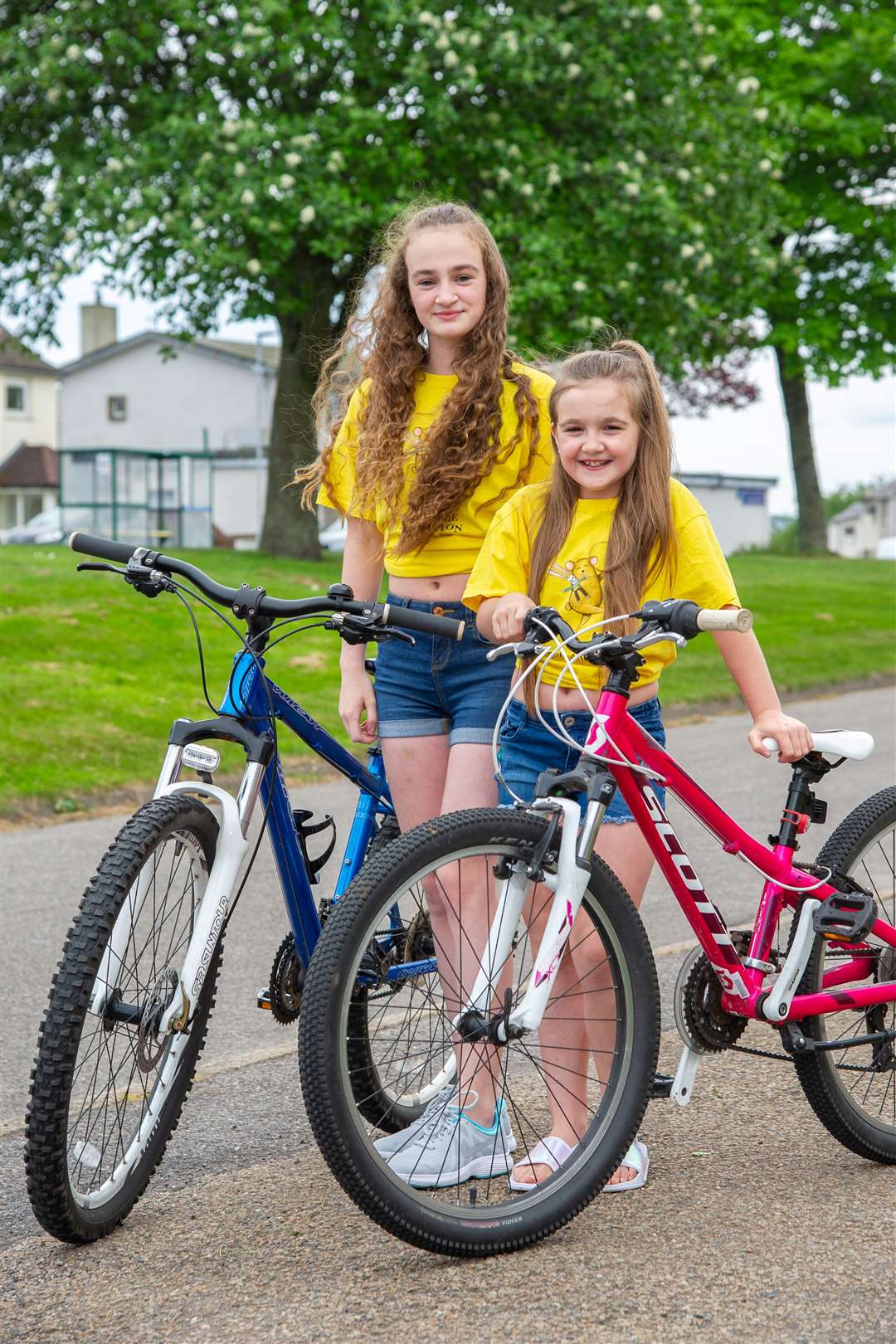Emma (left) and Lucy Stewart (right) chose to cycle 26 miles as Lucy will be 10 in July and Emma will be 16 in September. Picture: Daniel Forsyth.