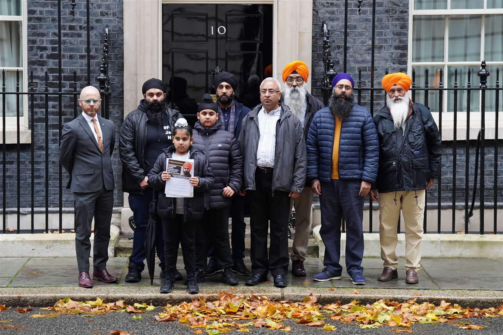 Members of the Free Jaggi Now Campaign hand in a petition to 10 Downing Street to mark five years of the arrest of Jagtar Singh Johal (James Manning/PA)