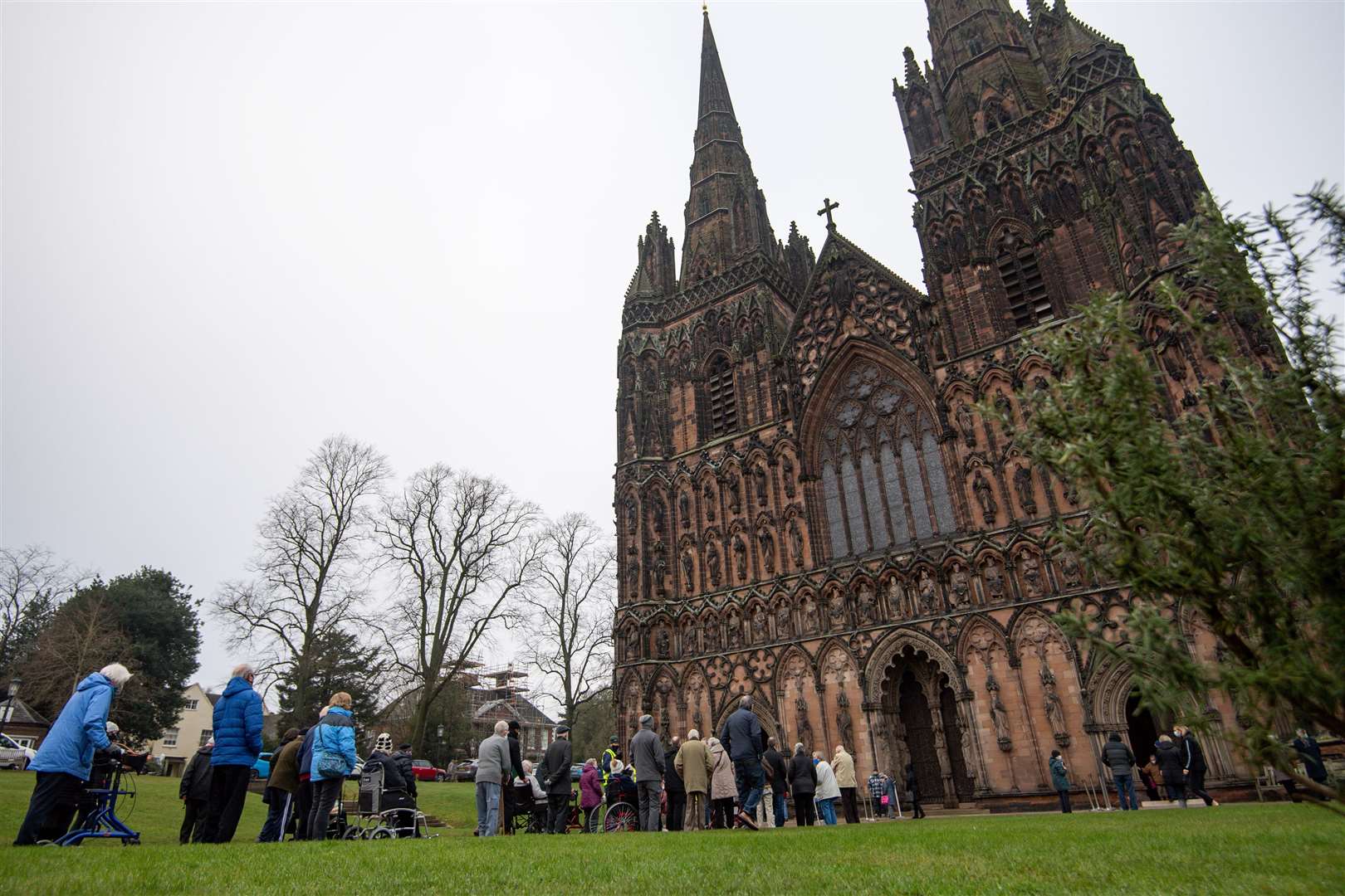 Members of the public queue outside the cathedral (Jacob King/PA)