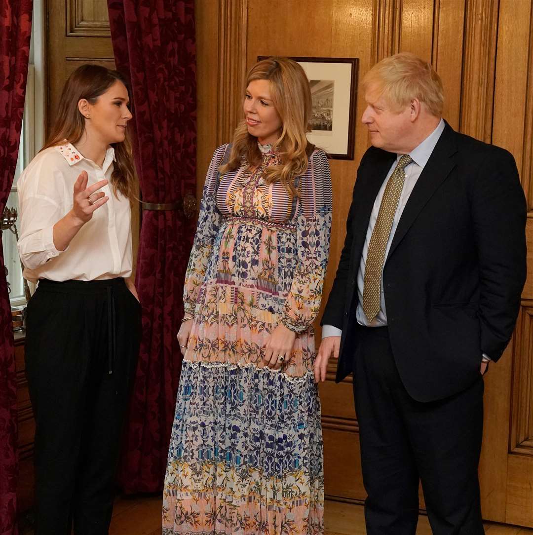 Boris Johnson with his partner Carrie Symonds (centre), during a reception to mark International Women’s Day at Downing Street in March. Their son Wilfred was born on April 29 (@10Downing Street/Twitter/PA)
