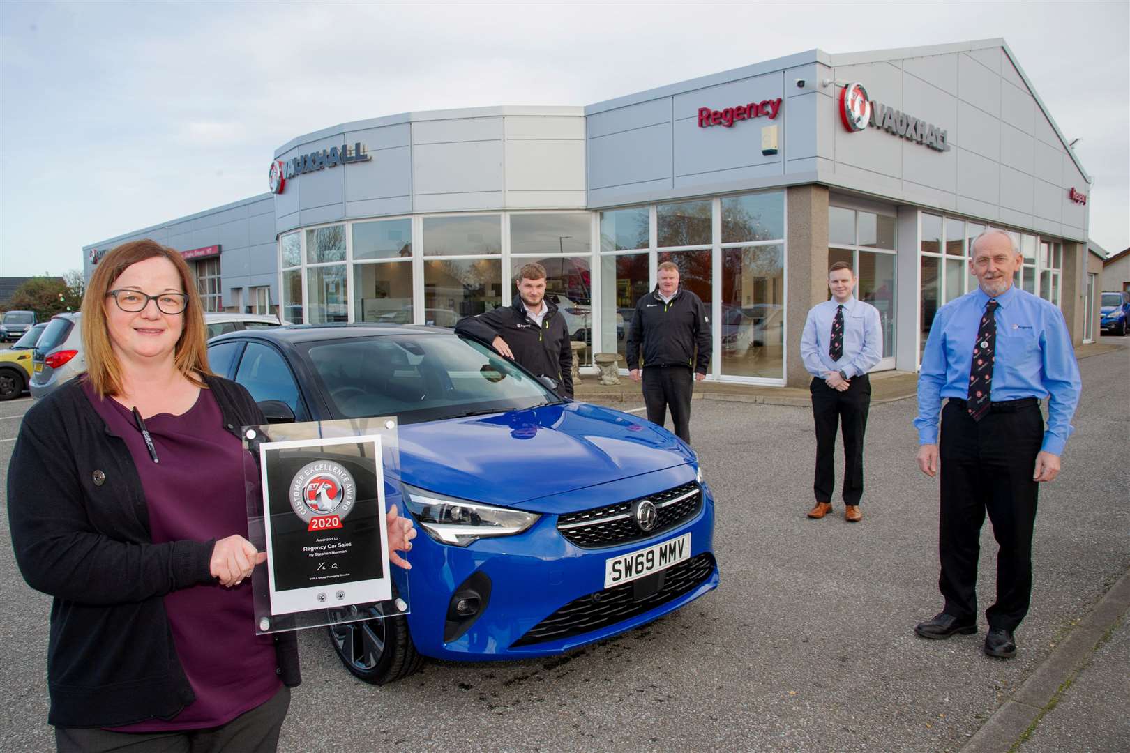 Celebrating scooping Vauxhall's UK Customer Excellence Award are Regency Car Sales team members (from left) Awlwyn Mair, Shawn Milne, Bryan Slater, Robert Campbell and Ian Legge. Picture: Daniel Forsyth