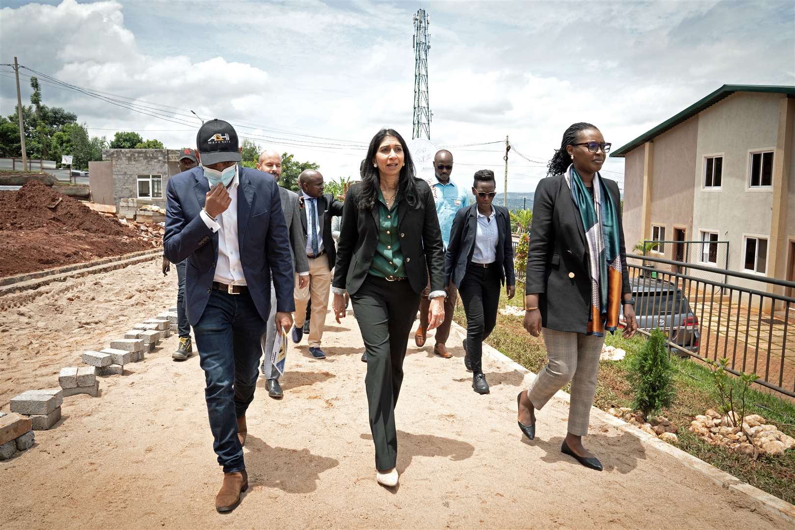 Home Secretary Suella Braverman touring a building site in Rwanda to see homes being constructed that could eventually house deported migrants (Stefan Rousseau/PA)