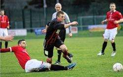 Deveronvale’s Scott Henry makes a tackle to thwart the Inverurie Locos attack. (IM)