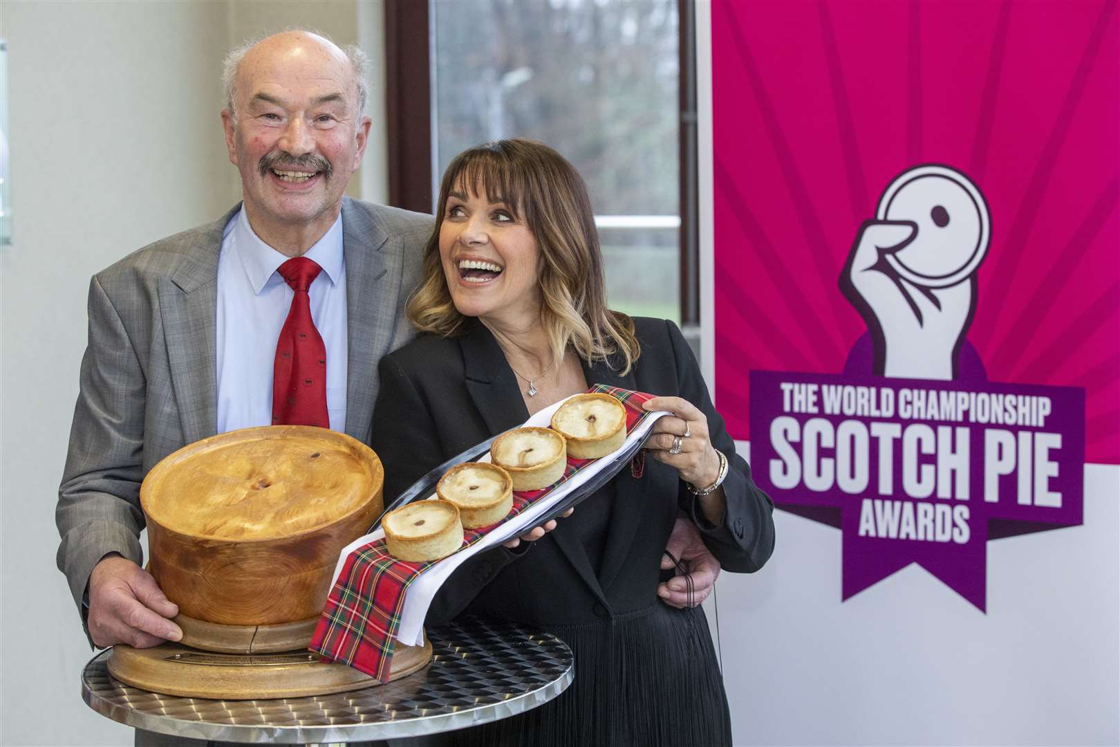 Awards host Carol Smille with Allan Pirie from James Pirie & Son who have won The World Championship Scotch Pie Award.