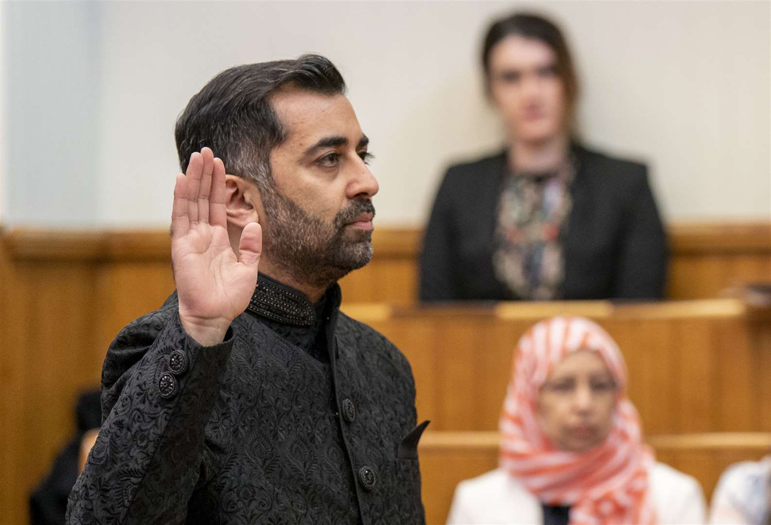 Humza Yousaf takes the oath as he is sworn in as First Minister of Scotland (Jane Barlow/PA)
