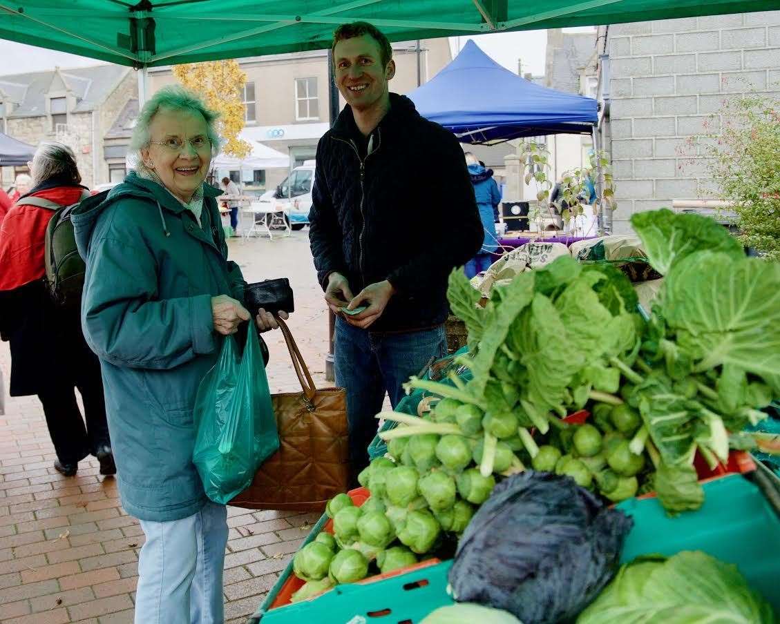 Buying some vegetables from Stuart Jamieson at the November market was Eileen Sutherland. Picture: Phil Harman