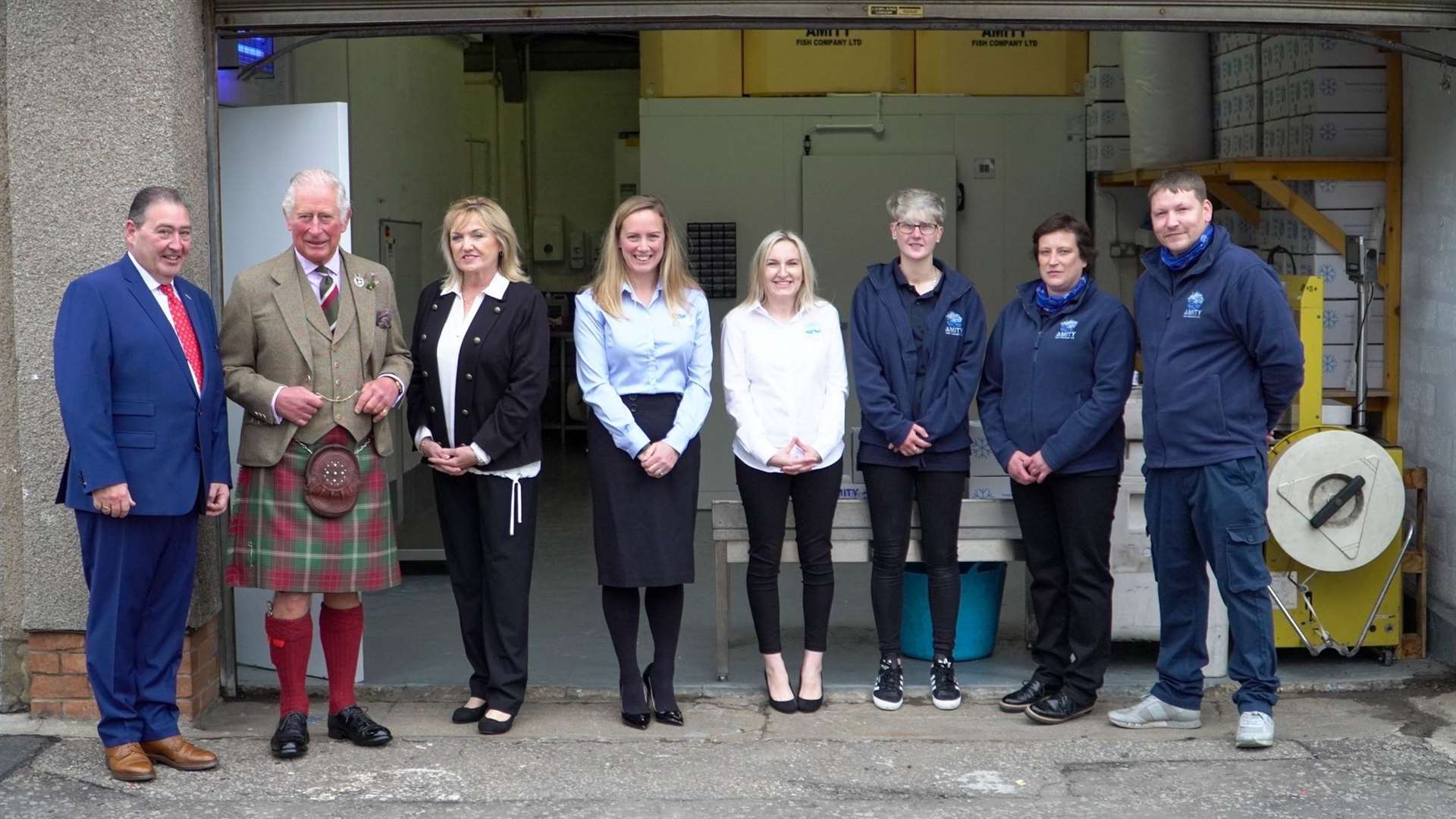 The Duke of Rothesay with Jimmy and Irene Buchan and staff at Amity Fish Company.