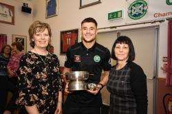 The Advertiser's Eileen innes (left) and Heather Green present Sam Urquhart with his Player of the Year award.
